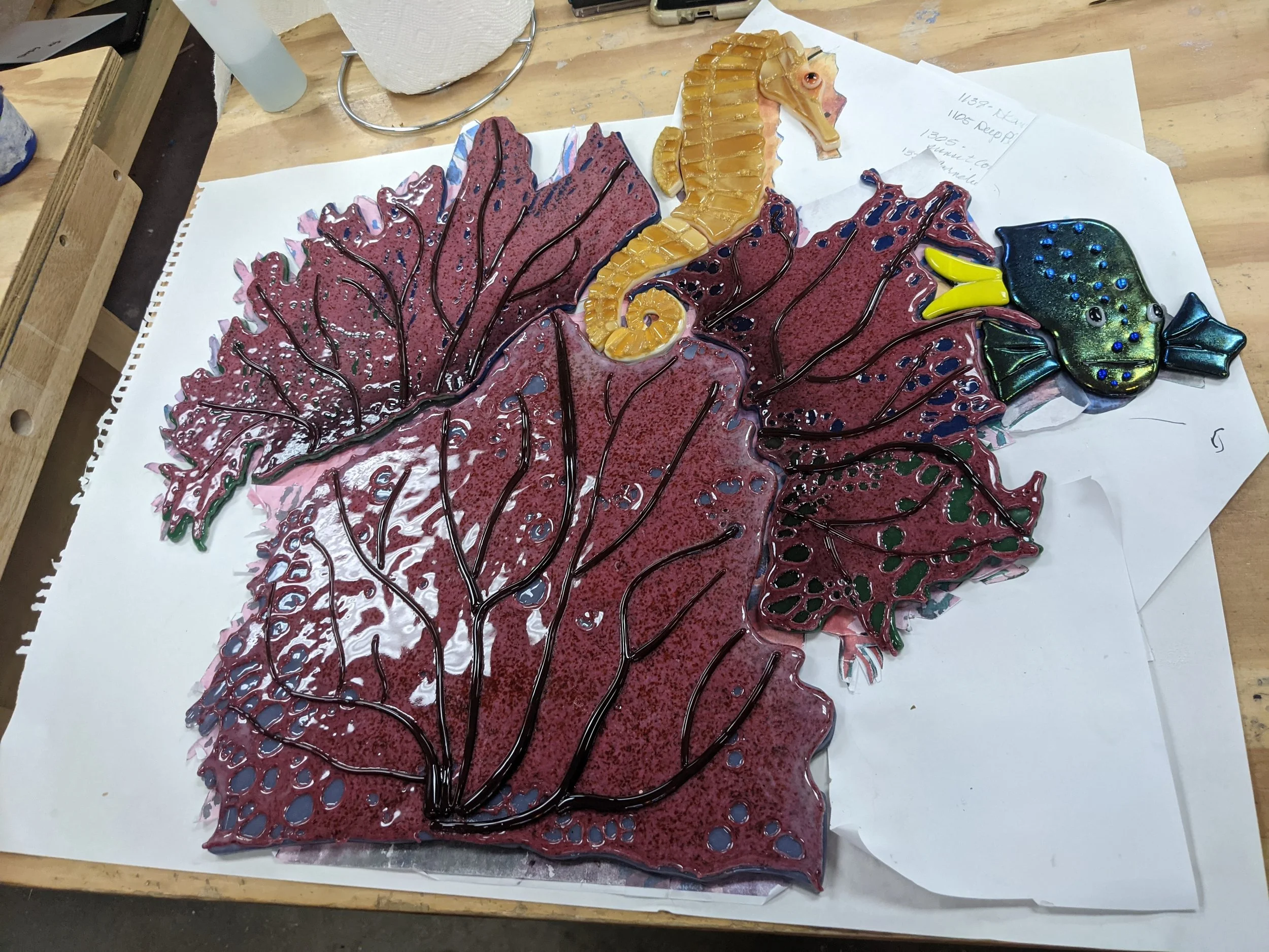 With the coral's shading and vitrograph veins in place, Laurie checks the fit of all the pieces a final time.