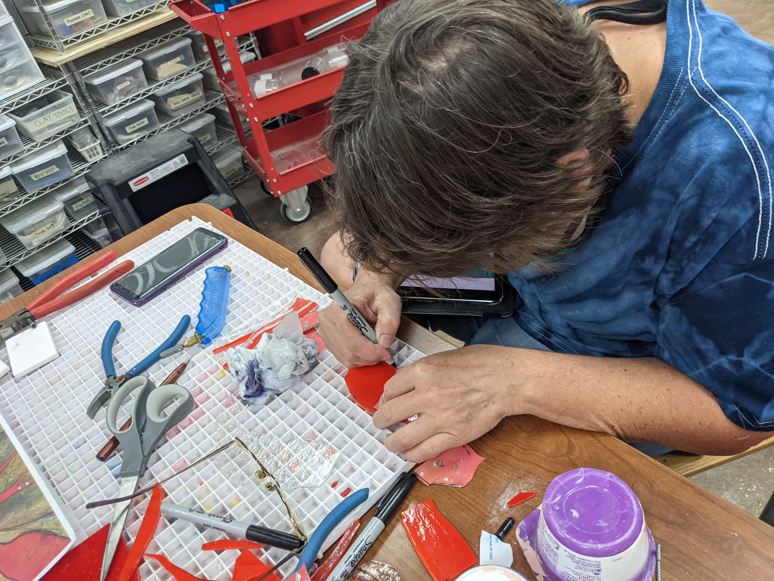 Jenny found that tracing shapes with a diamond-tip engraving pen and filling the etched lines with a Sharpie created perfect guidelines for precise ring saw cutting.