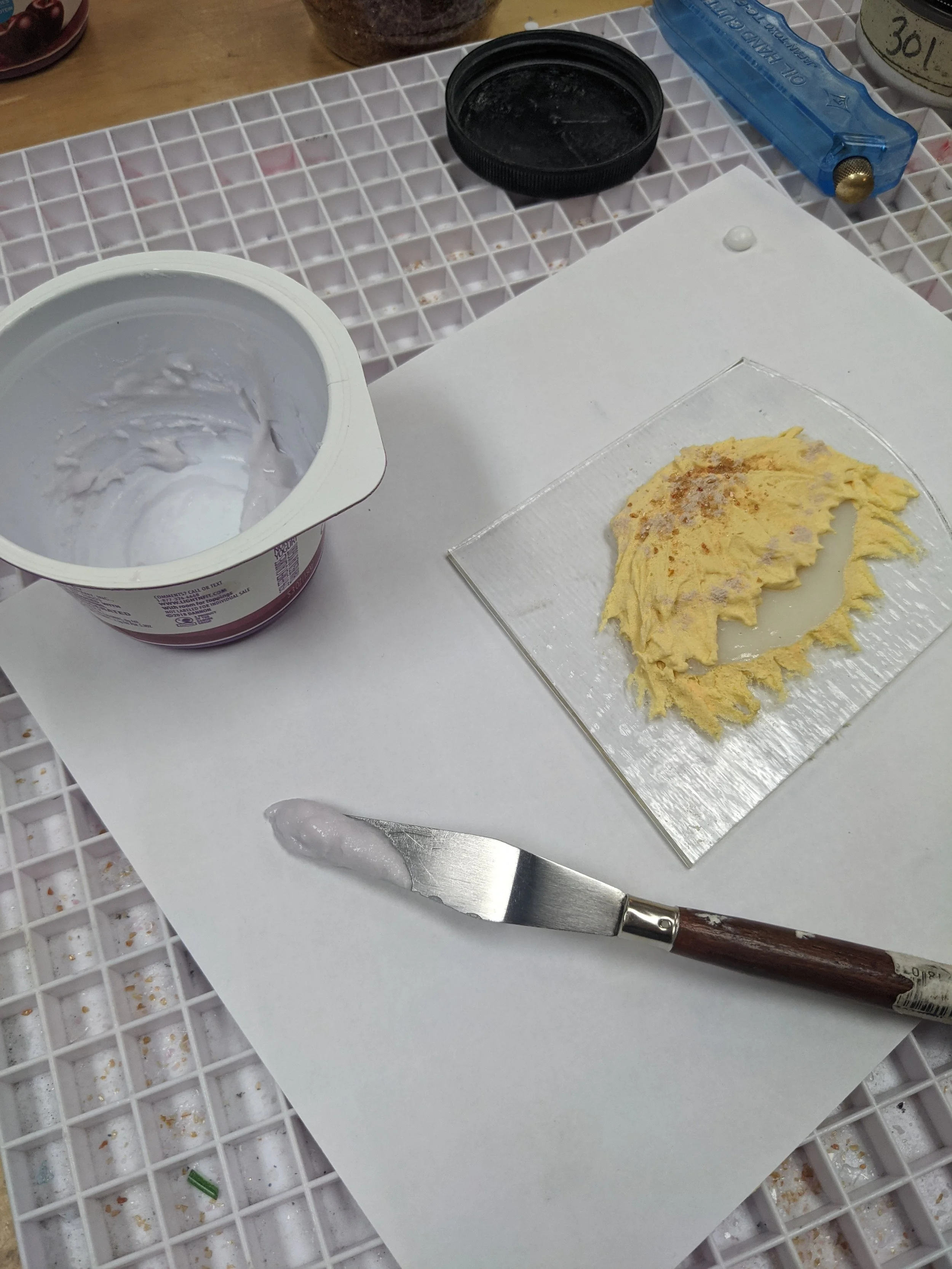 Kristine layered powder slurries around cut glass to "open" the oyster's shells. Here the oyster is awaiting it's pearl.