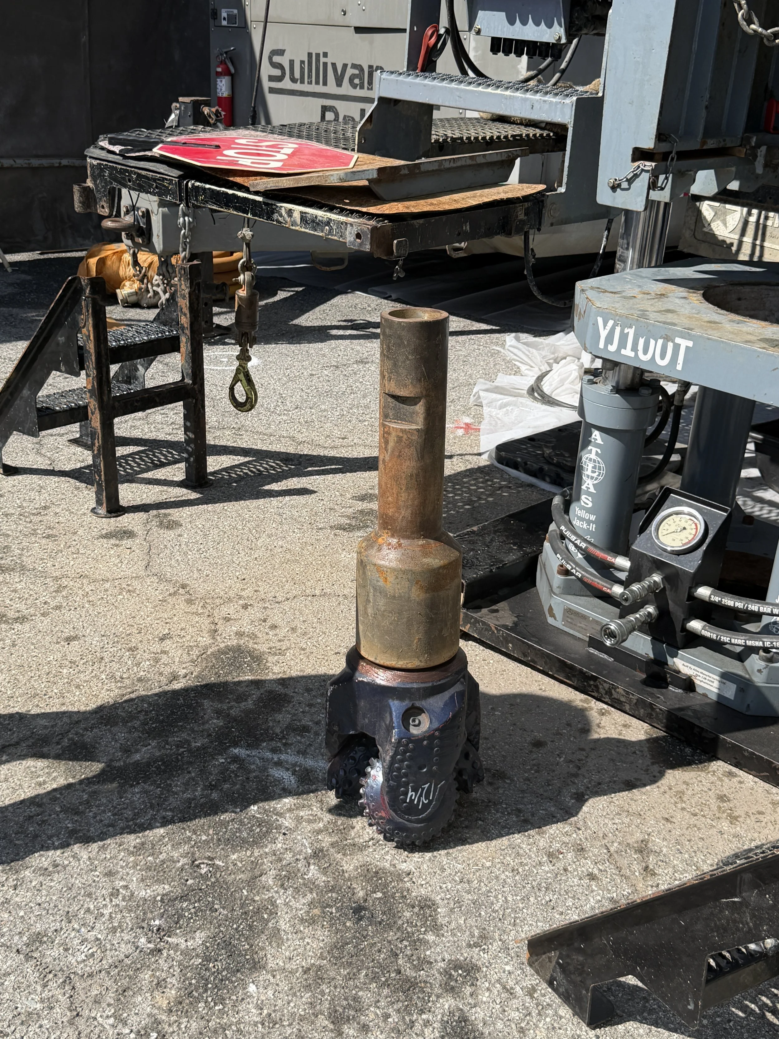 A Mud Drill bit standing upright