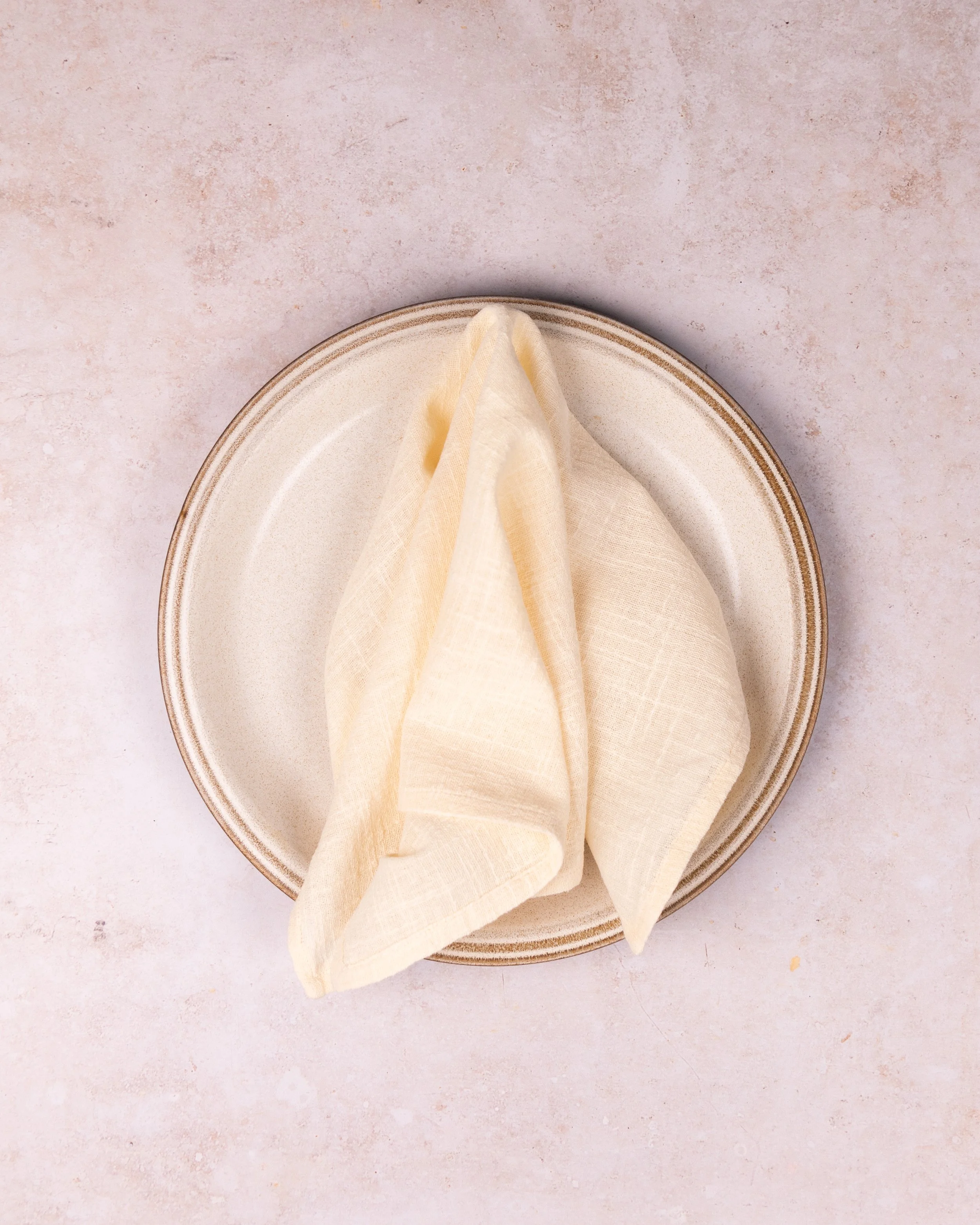 Cream linen napkin hire styled for a UK wedding tablescape