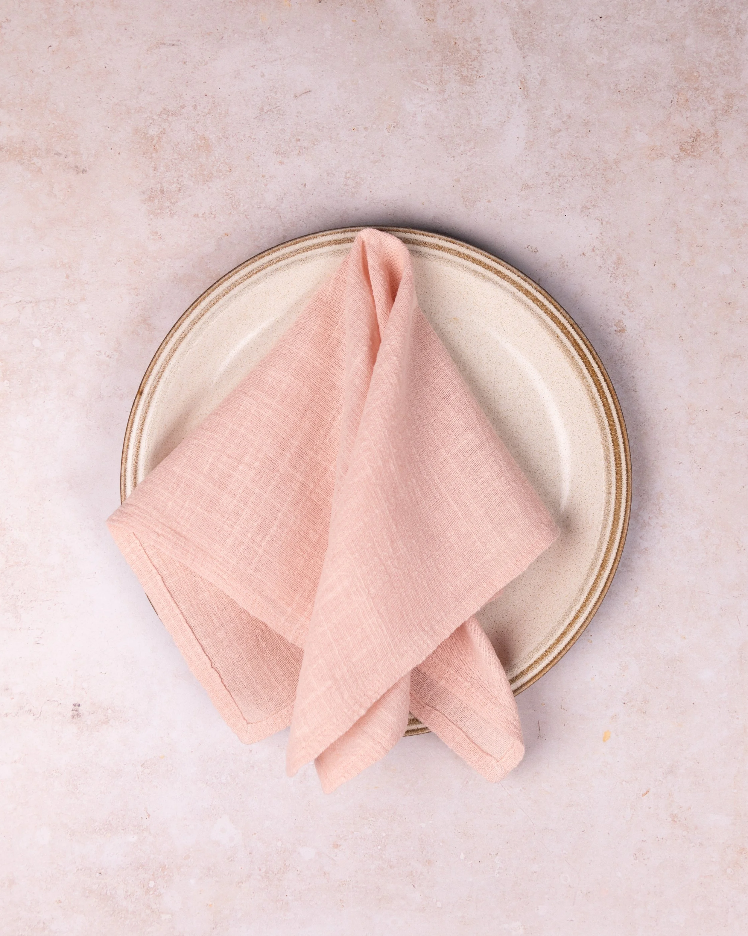 Light pink linen napkin hire styled for a Spring wedding tablescape