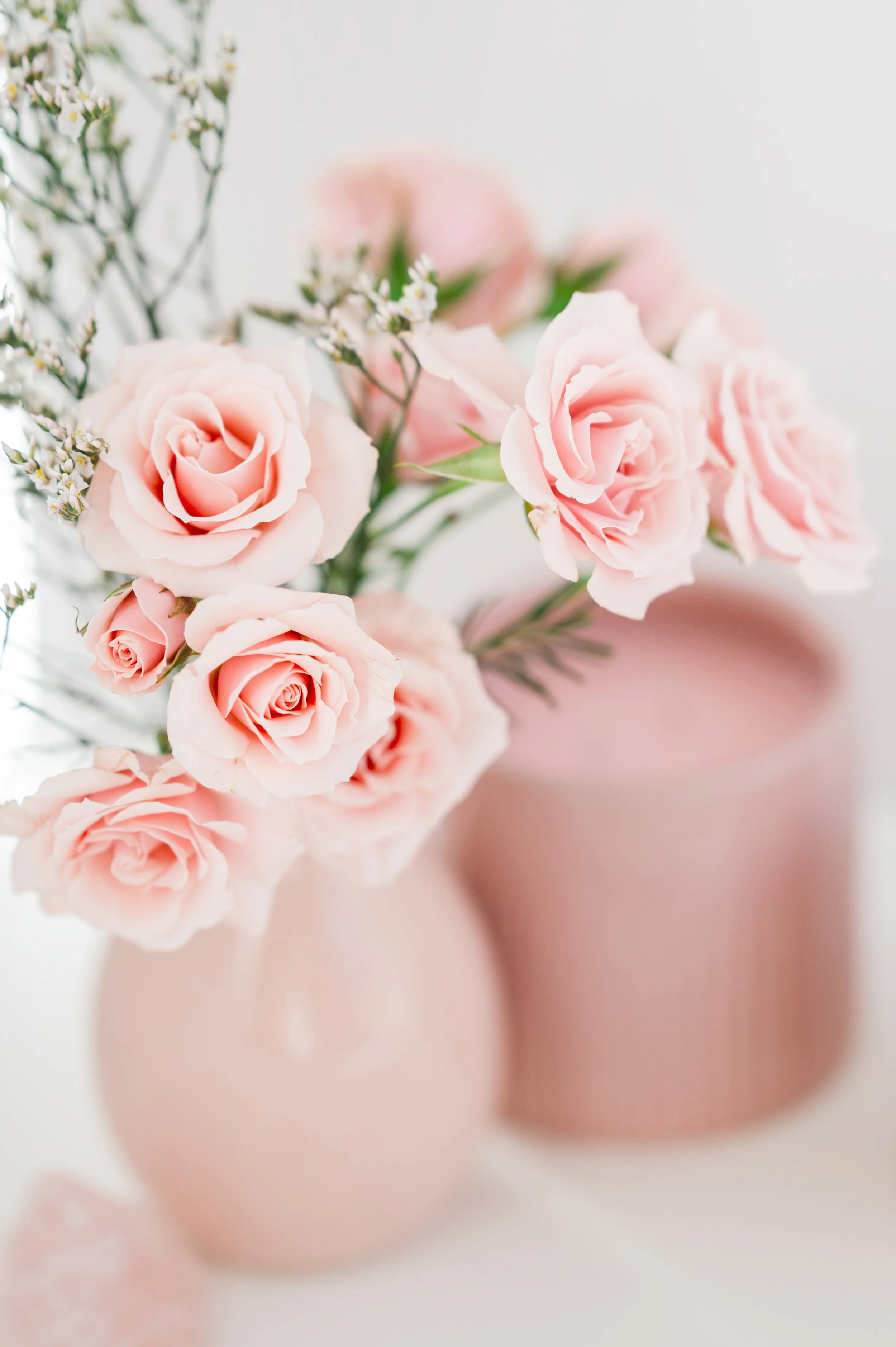 Pretty-Pink-Workspace with flowers and coffee cup for heart-led women entrepreneurs.