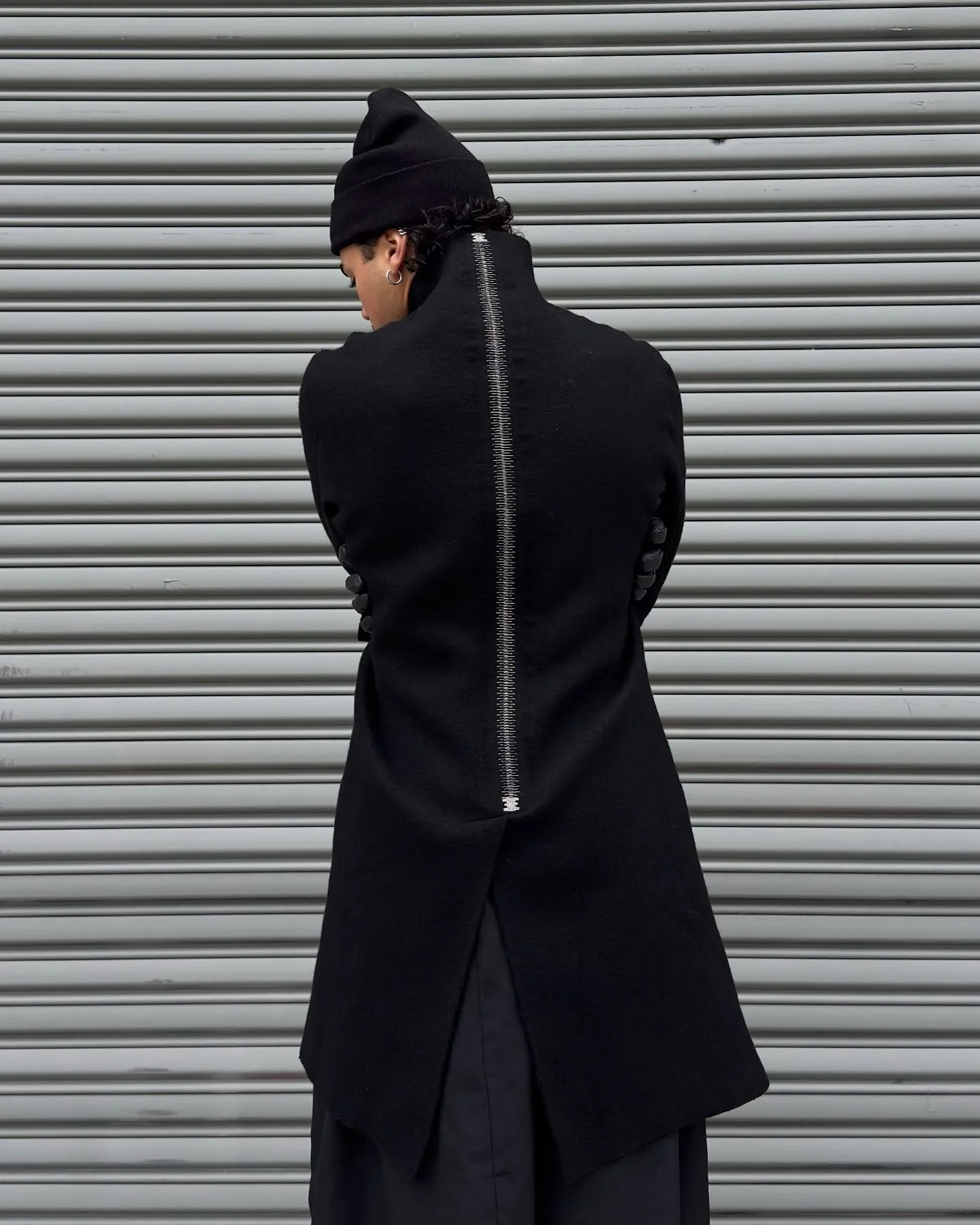 ISAAC SELLAM EXPERIENCE

&ldquo;DEGLINGUE&rdquo;  Wool Coat

Boiled virgin wool high neck coat featuring LOXX self locking fasteners, and Isaac&rsquo;s characteristic metal spine running the full length of the coat.

Available at in New York at AZUL.
