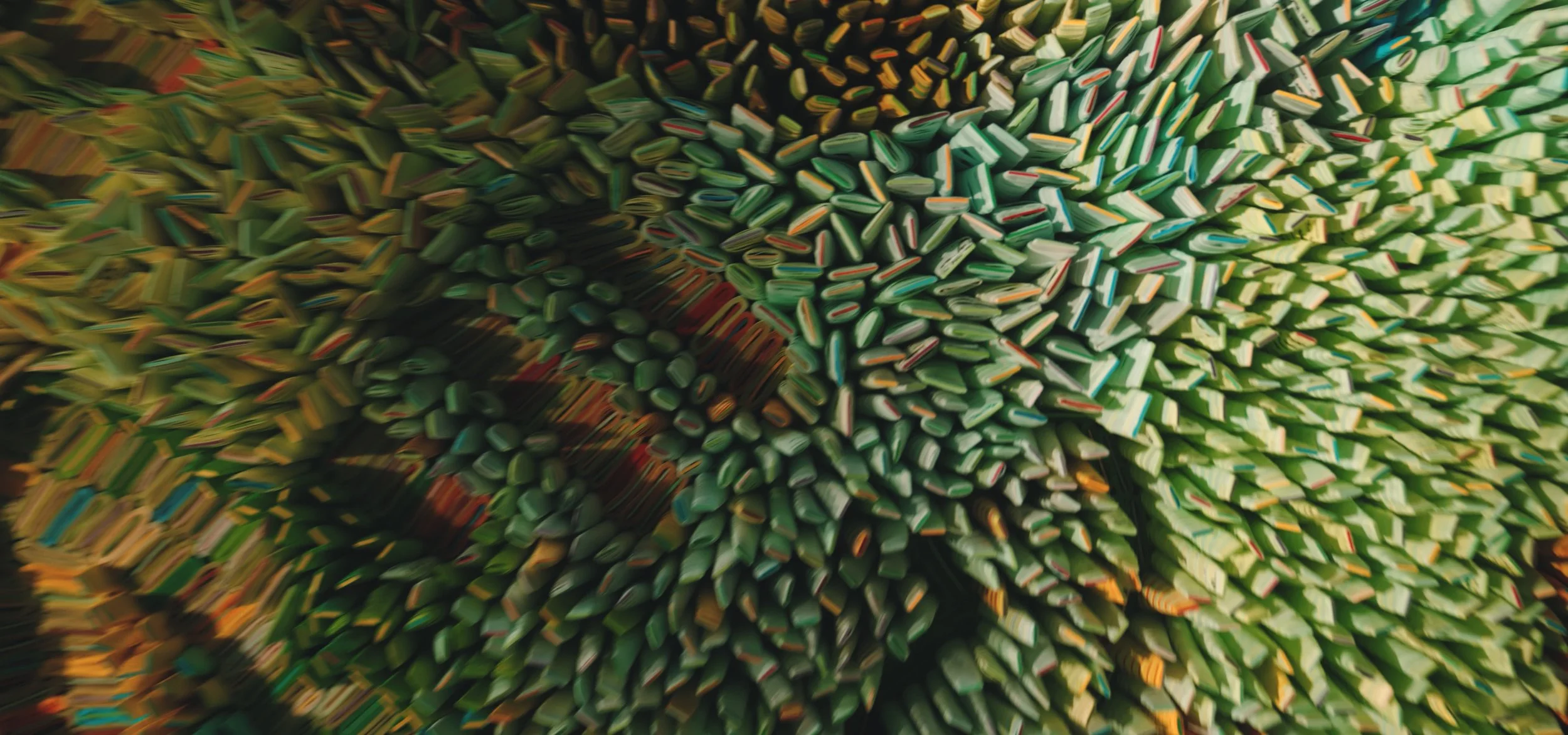 Close-up of colored wooden sticks arranged in a spherical shape.