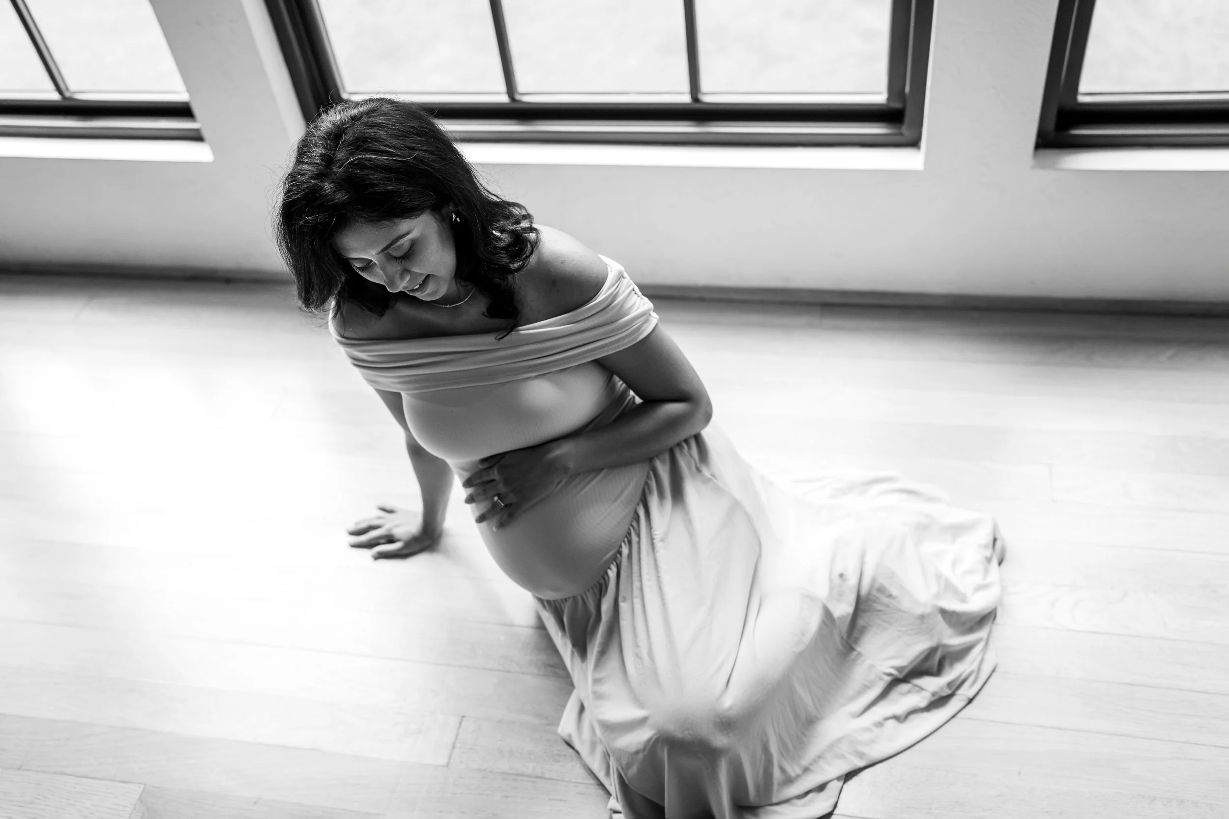 Pregnant mother posing during a black and white maternity photography session in The Woodlands, TX