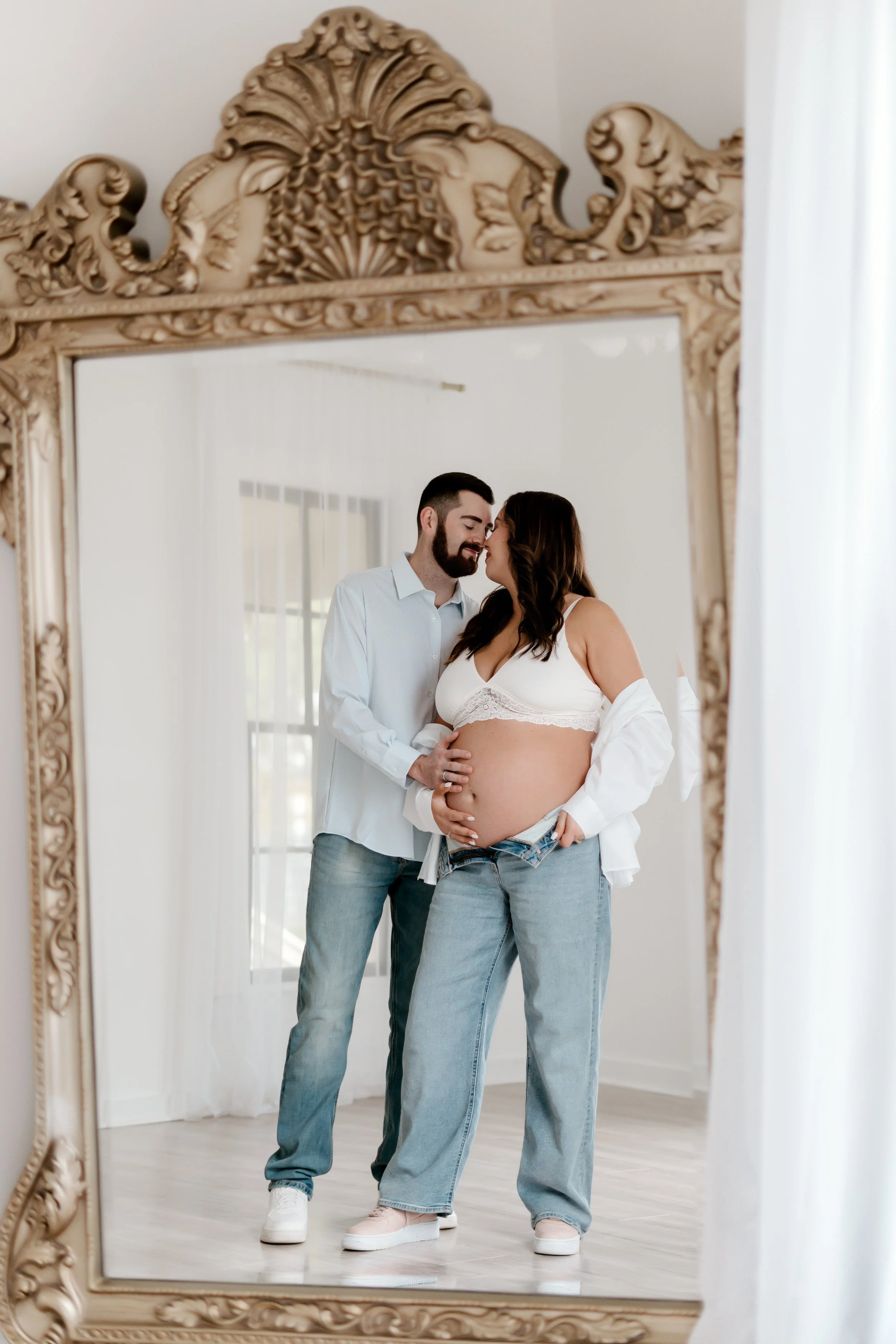 couple in studio at maternity session with Vanessa Tobias photo