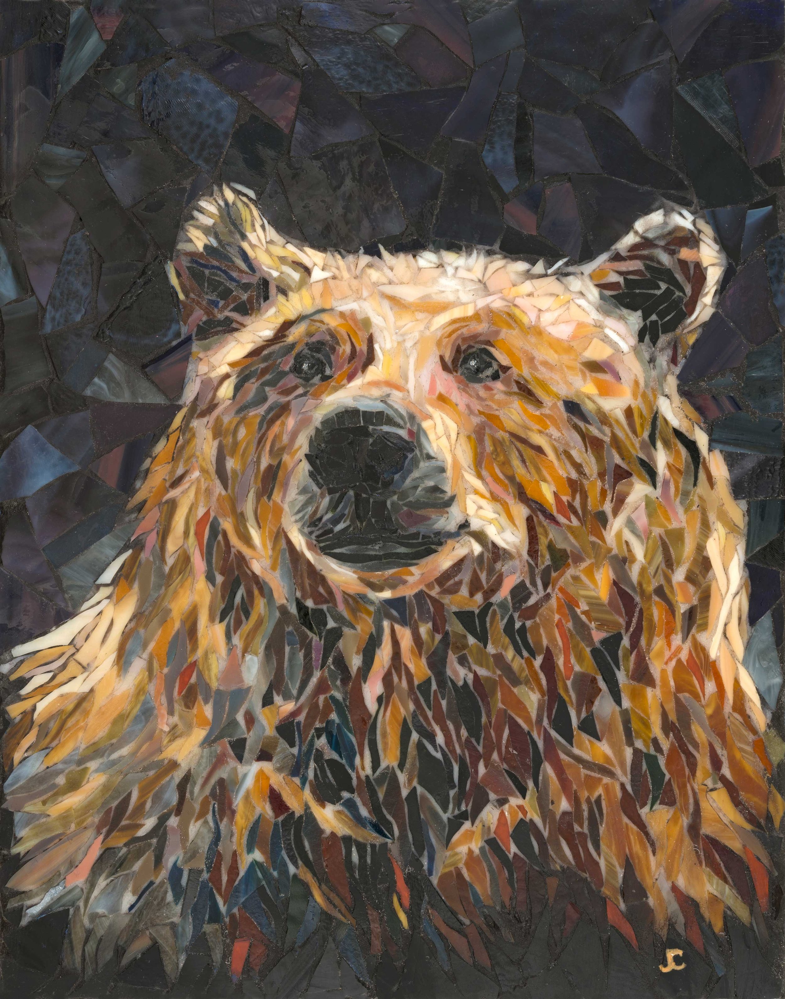 Wild At Heart, original stained glass bear mosaic by Joyce Casey in warm amber, gold and brown against a dark blue and purple background.