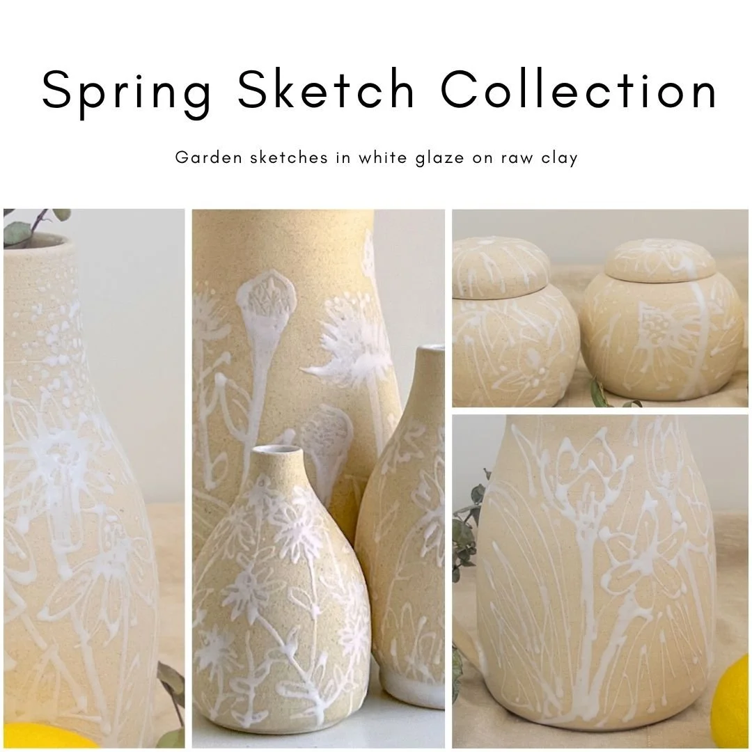 Collection of white glazed clay vases with botanical sketches in a spring-themed photo display.