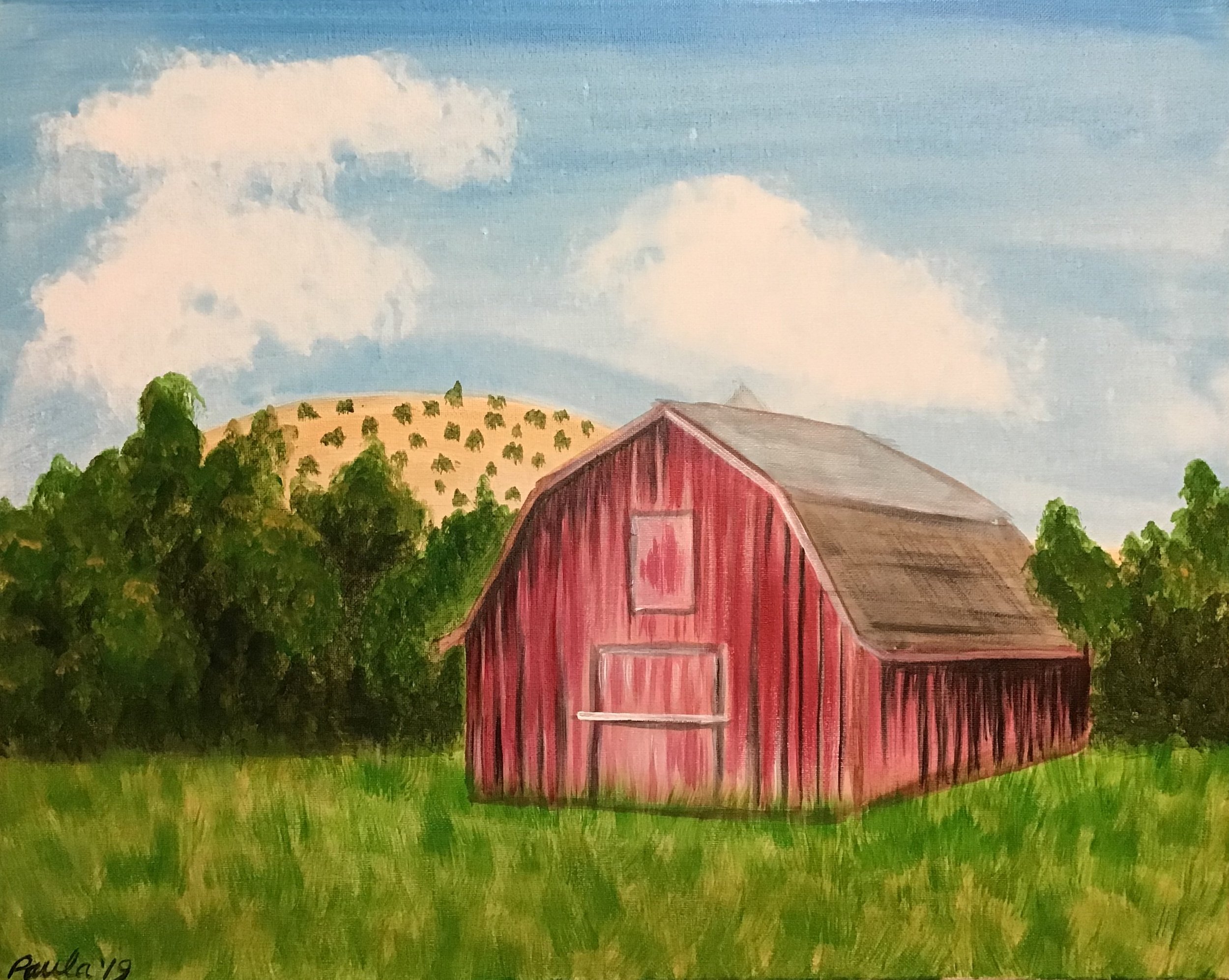 Painting of a red barn in a green field with trees and small hills in the background under a blue sky with clouds. Paint party acrylic painting.