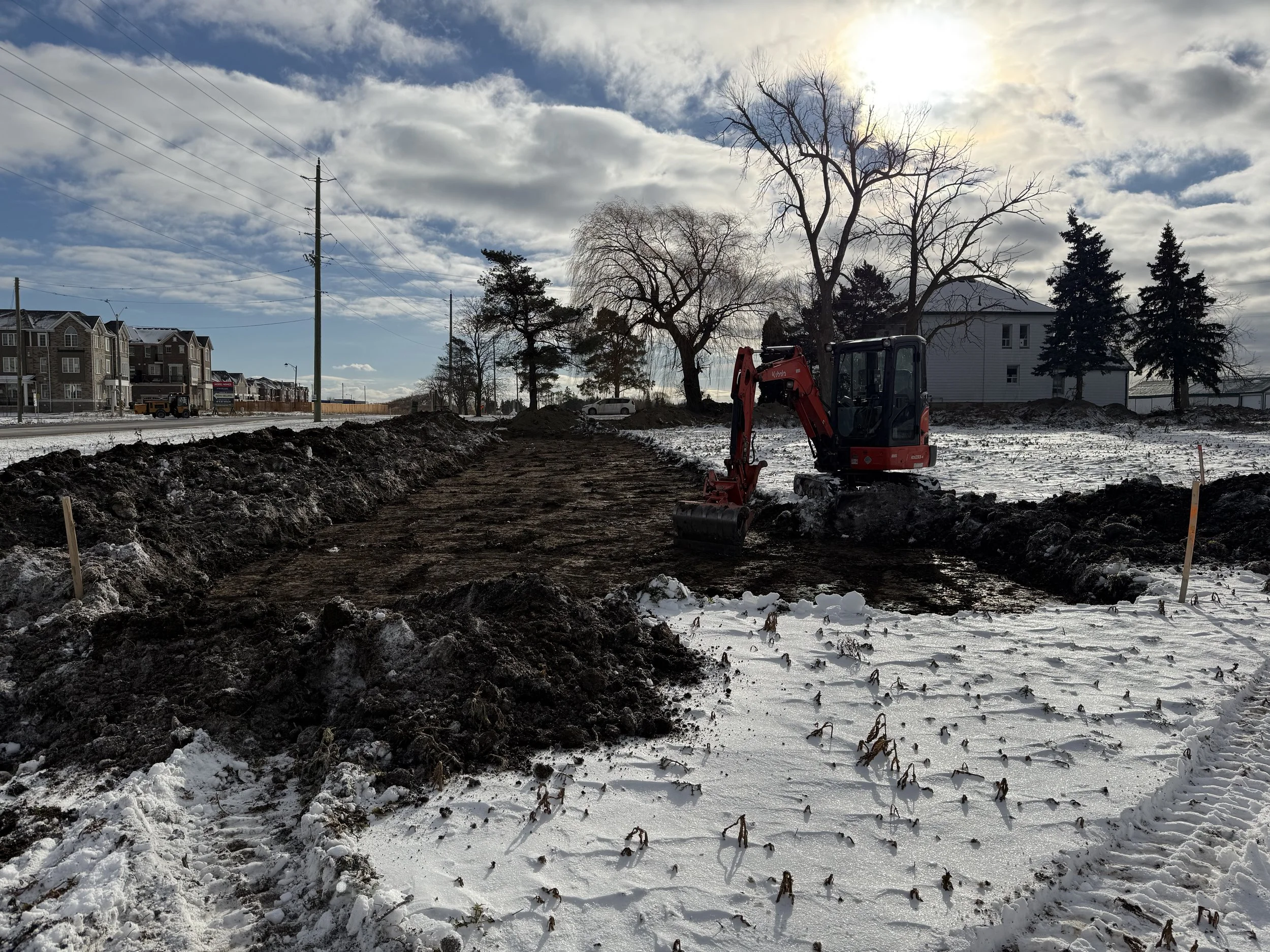 Mechanical topsoil removal for archaeological excavation