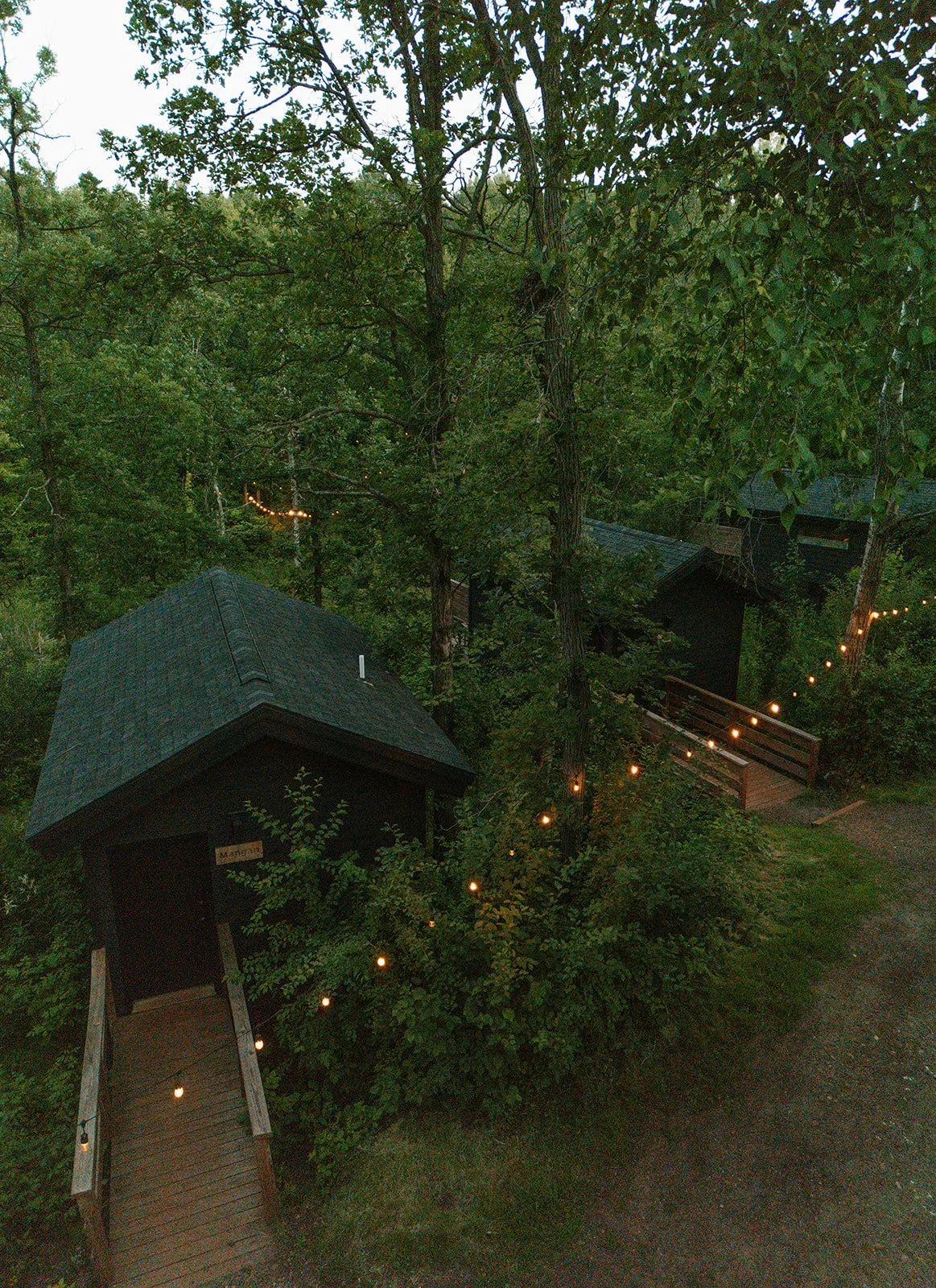 String lights in the evening at the cabin rentals at Cuyuna Cove in Crosby, MN