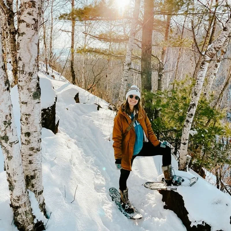Snowshoeing through the forest trails in winter near Cuyuna Country State Recreation Area in Crosby Minnesota
