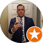 Google review of Lemelana MedSpa. A man in a suit taking a selfie in front of a mirror and holding a phone.