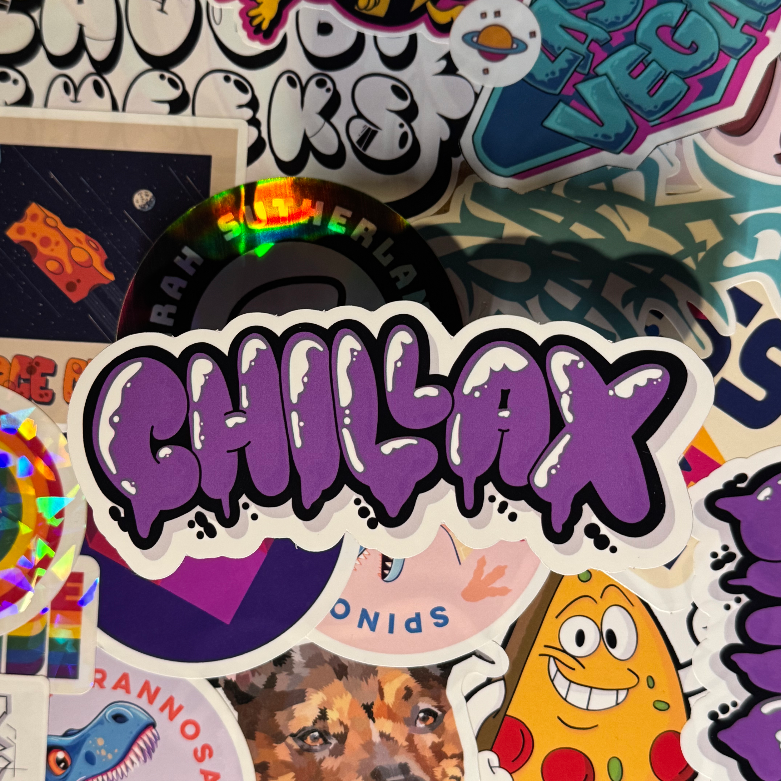 photo of hand-made sticker to show quality of the word chillax which means chill out with purple colors in graffiti style