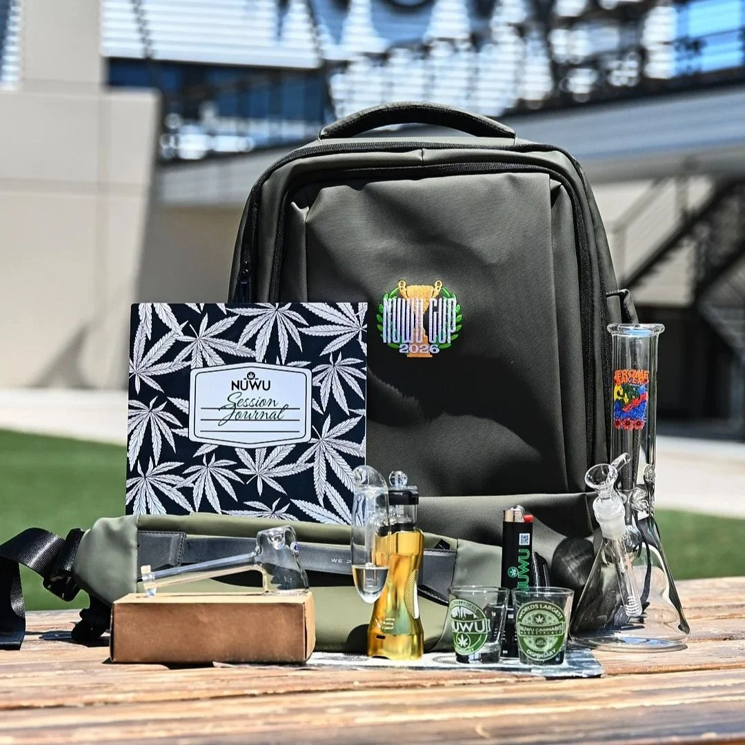 The official 2026 NuWu Cup Full Kit A featuring the premium backpack, JBD bong, session journal, and custom glass on a courtyard table in Las Vegas.