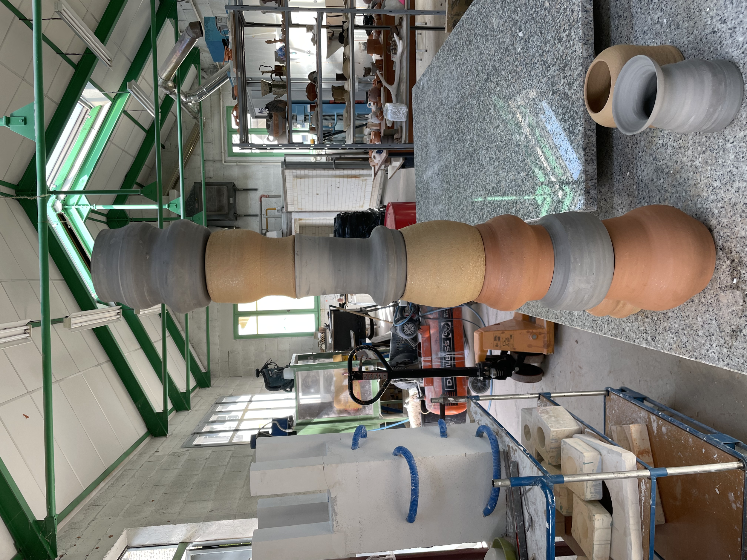 Dry pots, ready to be fired, mixed clays.