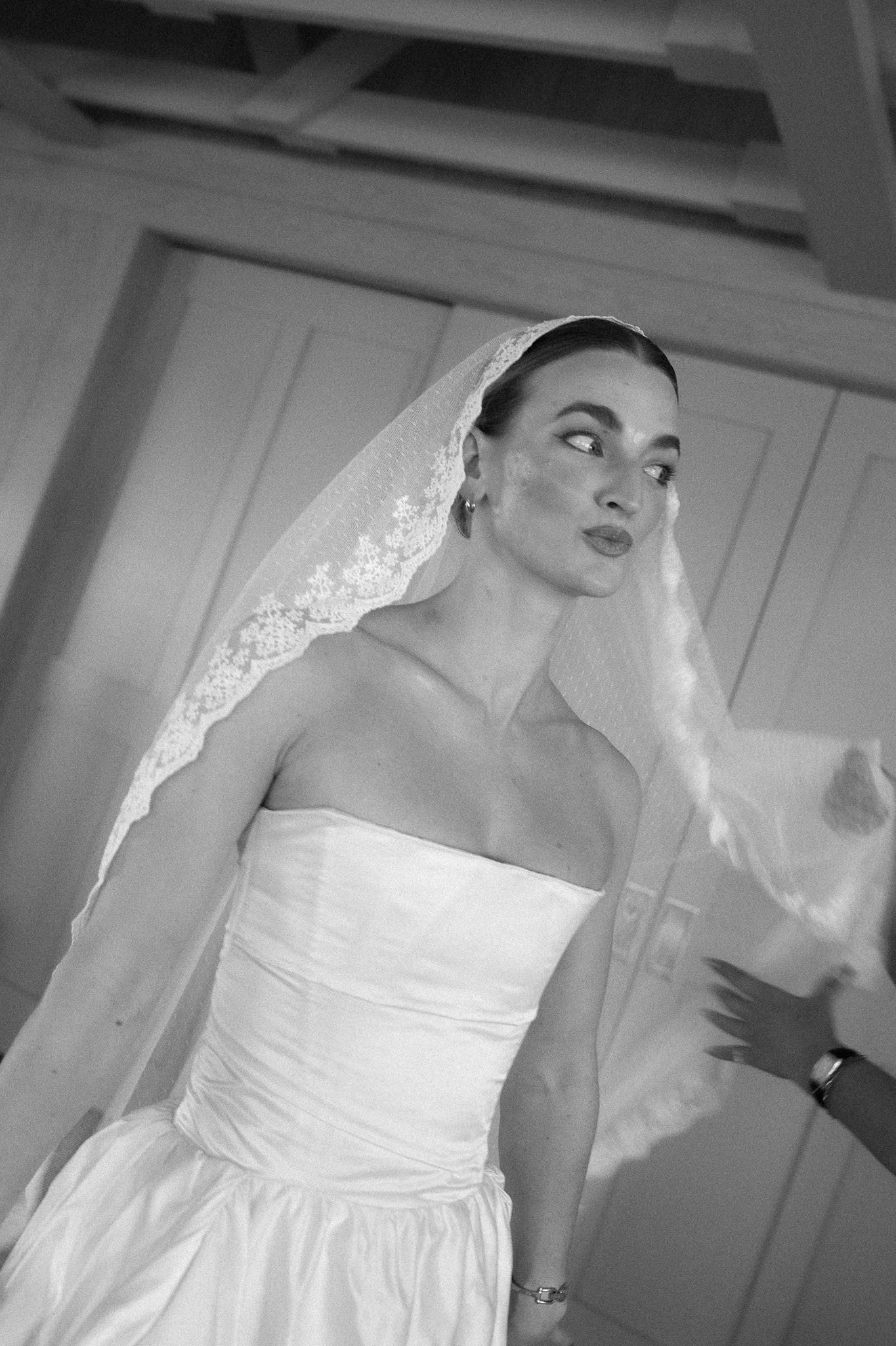 black and white portrait of bride with veil