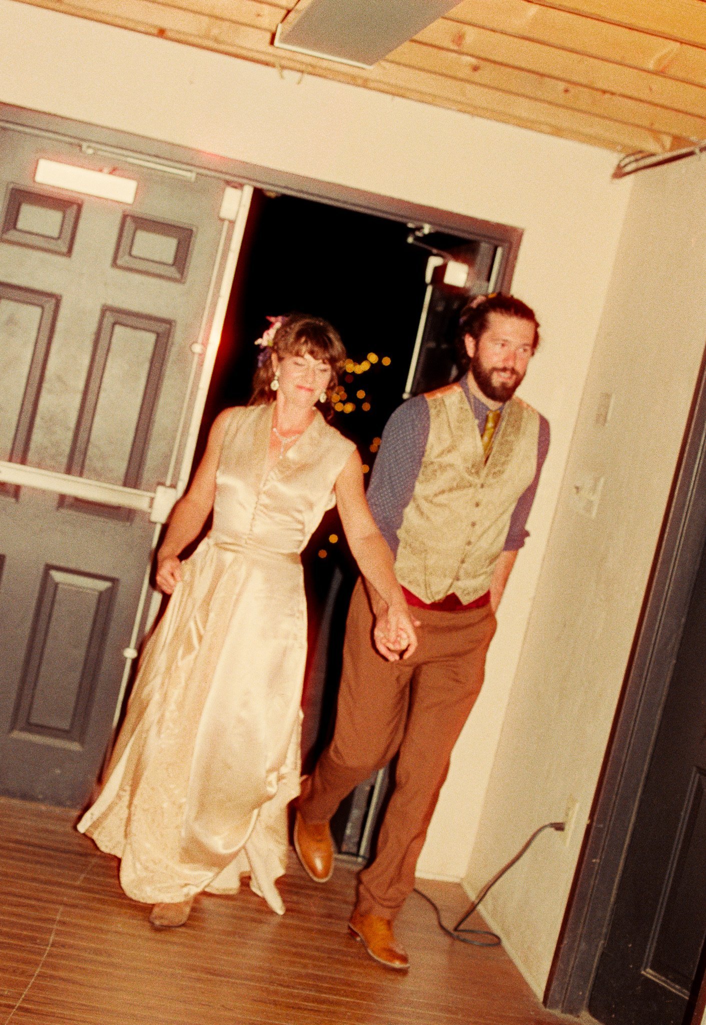 bride and groom entering reception 