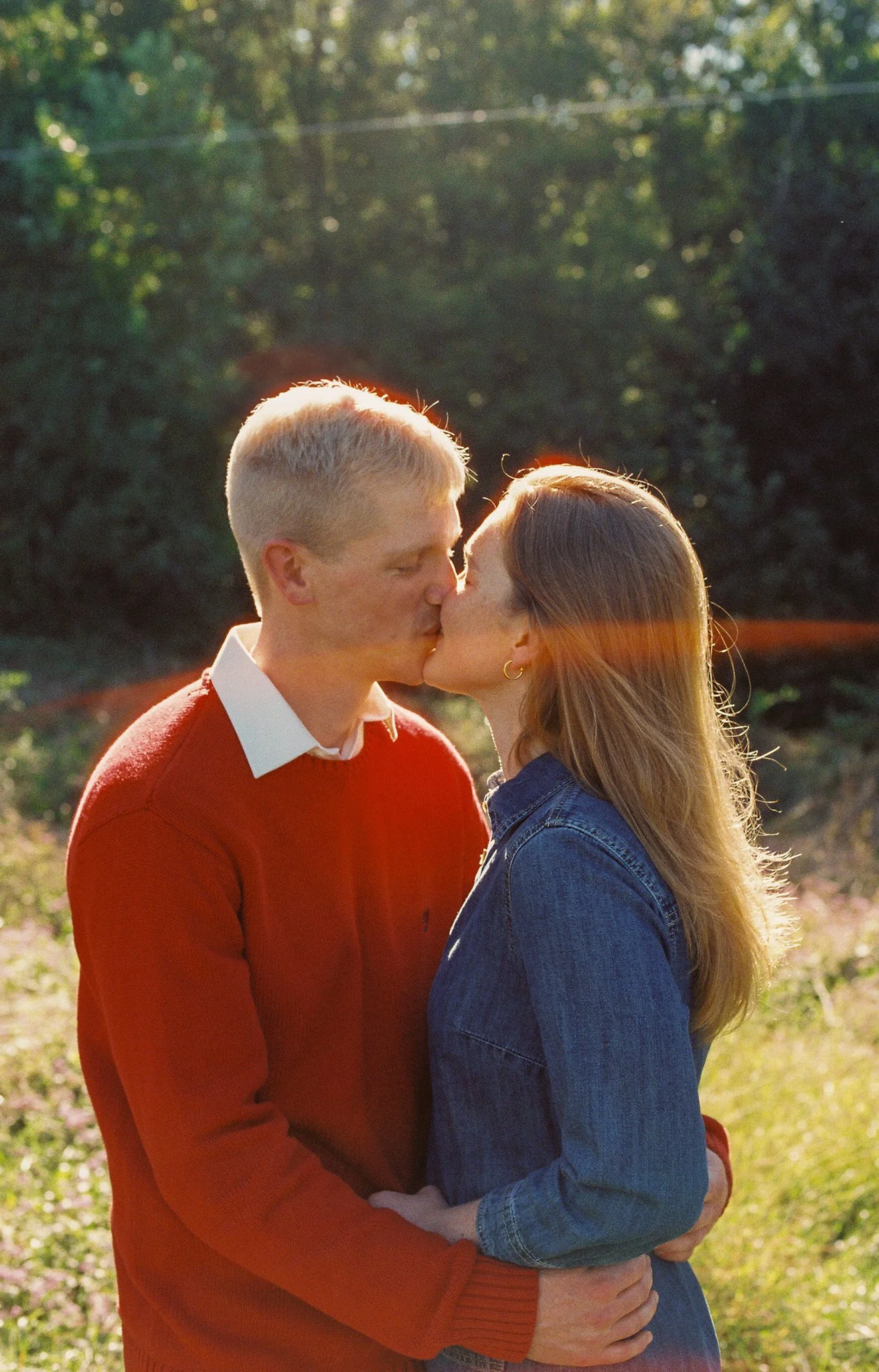 sun flare couple kissing
