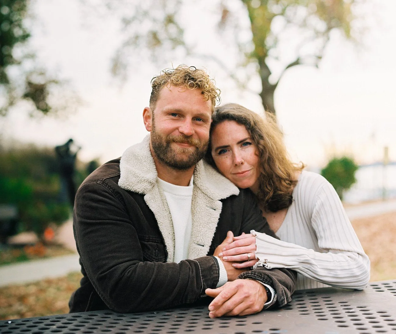 couple holding hands oudoors