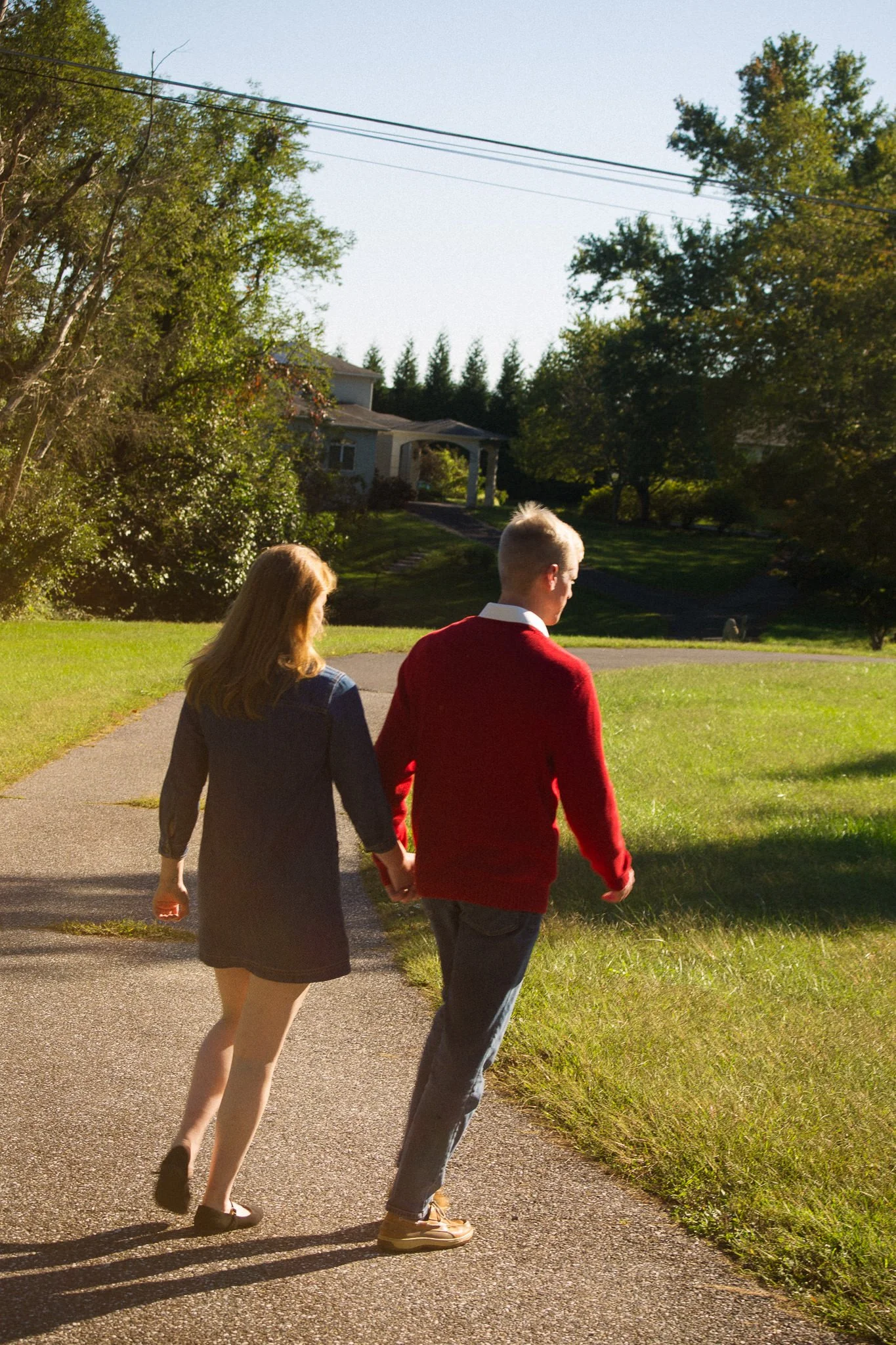 golden hour lifestyle session couple walking outdoors