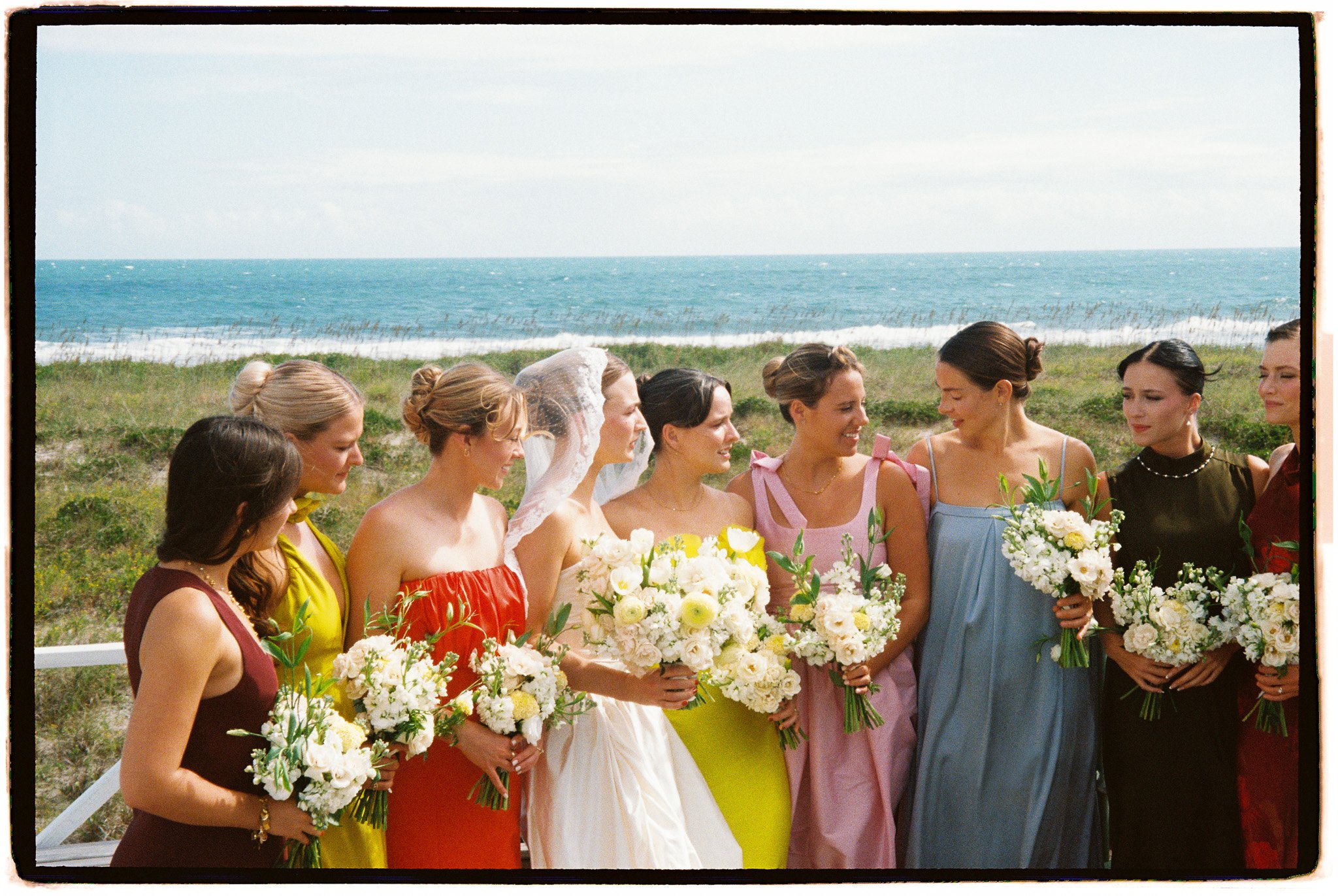colorful bridesmaids in coastal wedding
