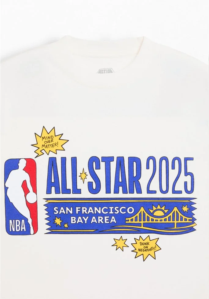 White NBA t-shirt with colorful graphics promoting the 2025 All-Star game in San Francisco Bay Area, including a logo of a basketball player, the Golden Gate Bridge, and text about the event.
