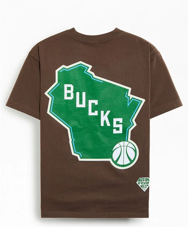Brown T-shirt with a green outline map of the state of Wisconsin, with the word 'BUCKS' inside, and a small basketball graphic at the bottom right, featuring additional text 'Action Figure'.
