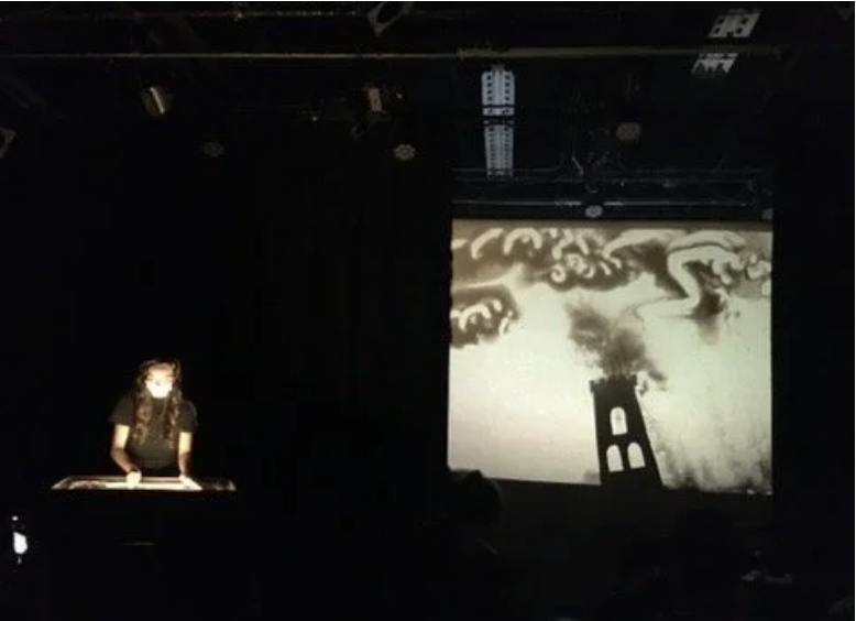 3 musicians playing instruments including the accordion and clarinet