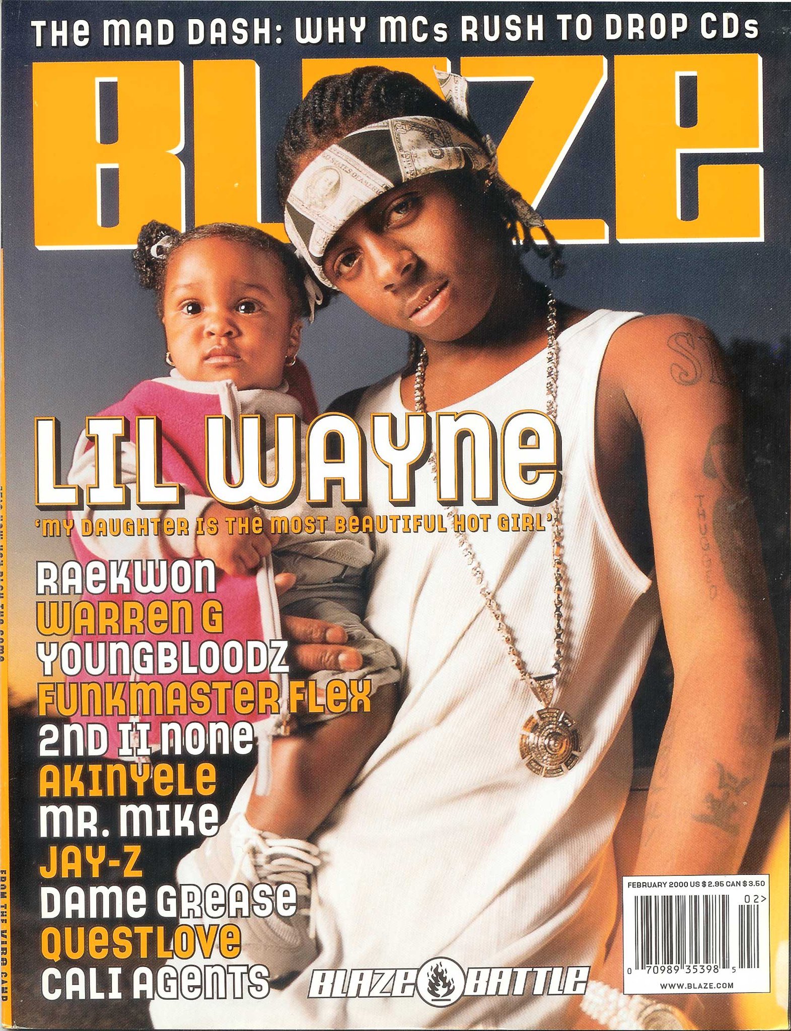 Magazine cover featuring Lil Wayne holding a young girl, with the headline 'The Mad Dash: Why MCs Rush to Drop CDs.' The cover lists several hip-hop artists and features the band Blaze Battle.