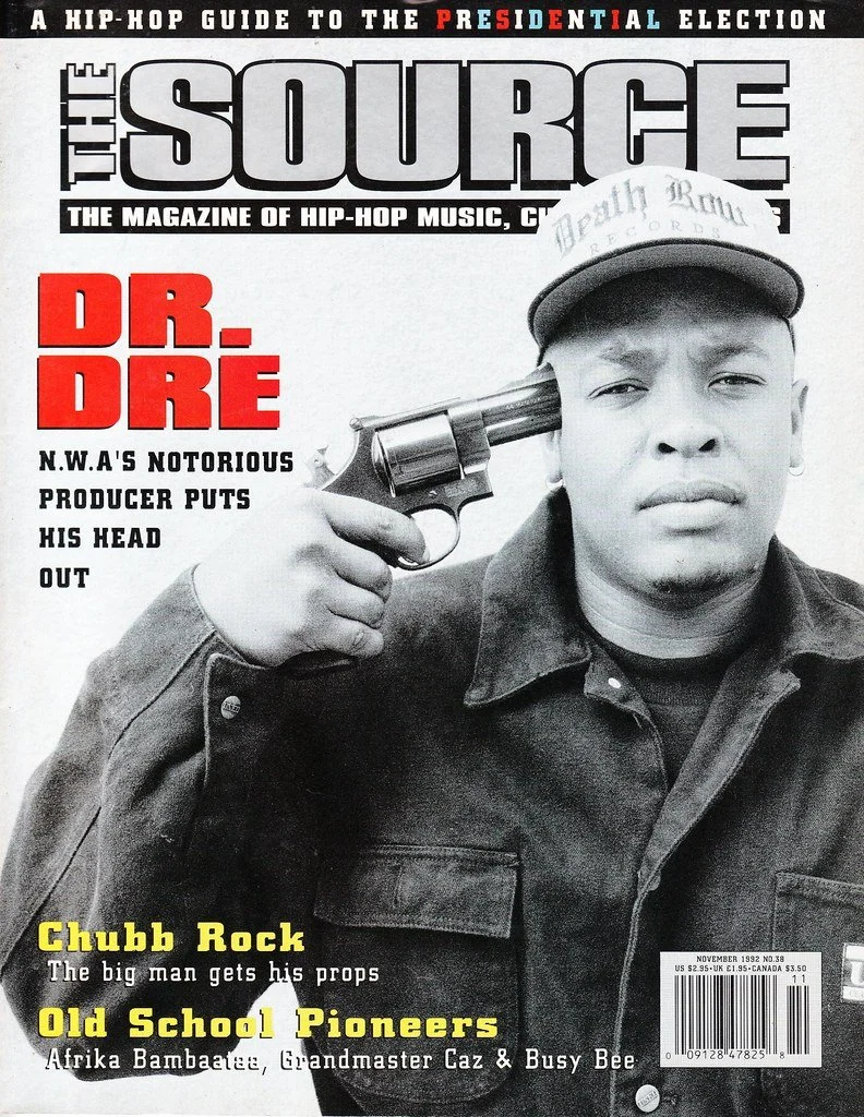Magazine cover titled "The Source," featuring a black and white photo of Dr. Dre holding a gun to his temple, wearing a cap and jacket, with bold red text "DR. DRE" and additional headlines about hip-hop and related artists.