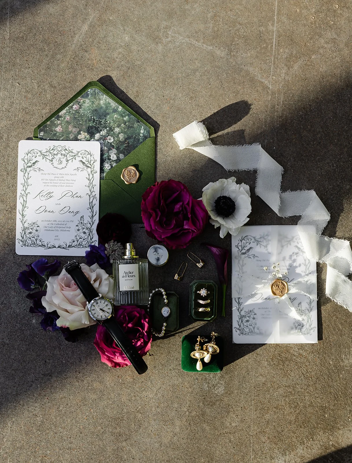 Wedding invitation, flowers, watch, perfume, jewelry, and accessories arranged on a surface, likely for a wedding or special occasion.
