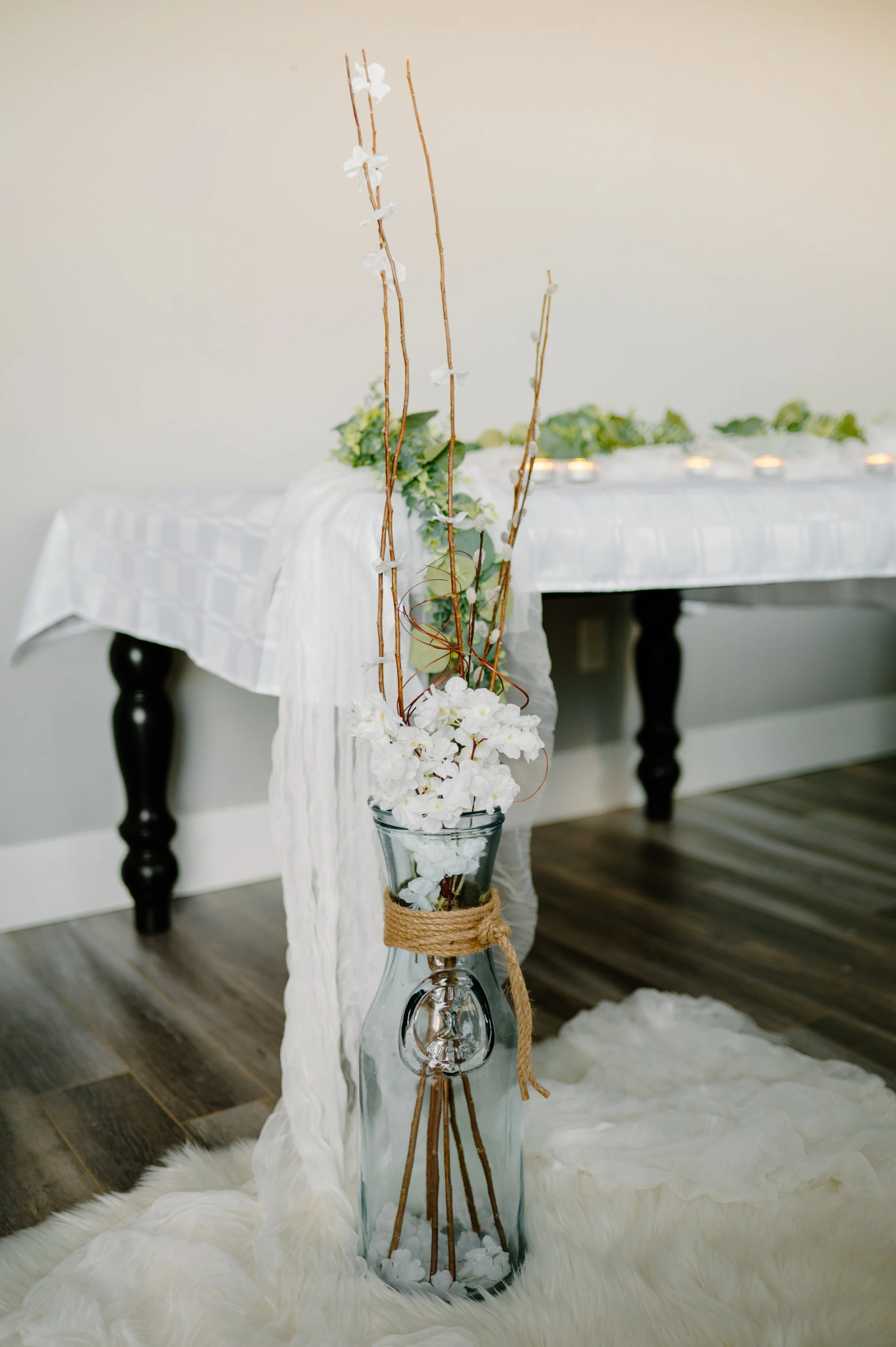 Clear glass vase with branches and flowers.
18.5" H of the vase. 1-day rental is $30. 