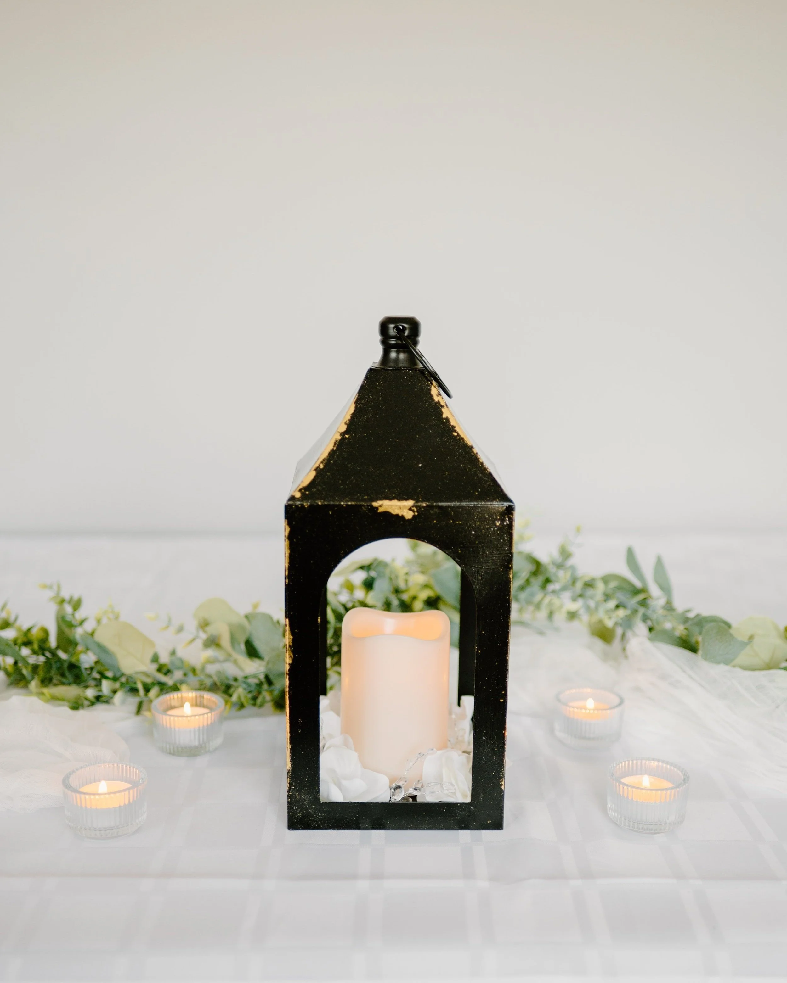 Black and gold lantern. 1 candle. 
12" H. 1-day rental is $20.