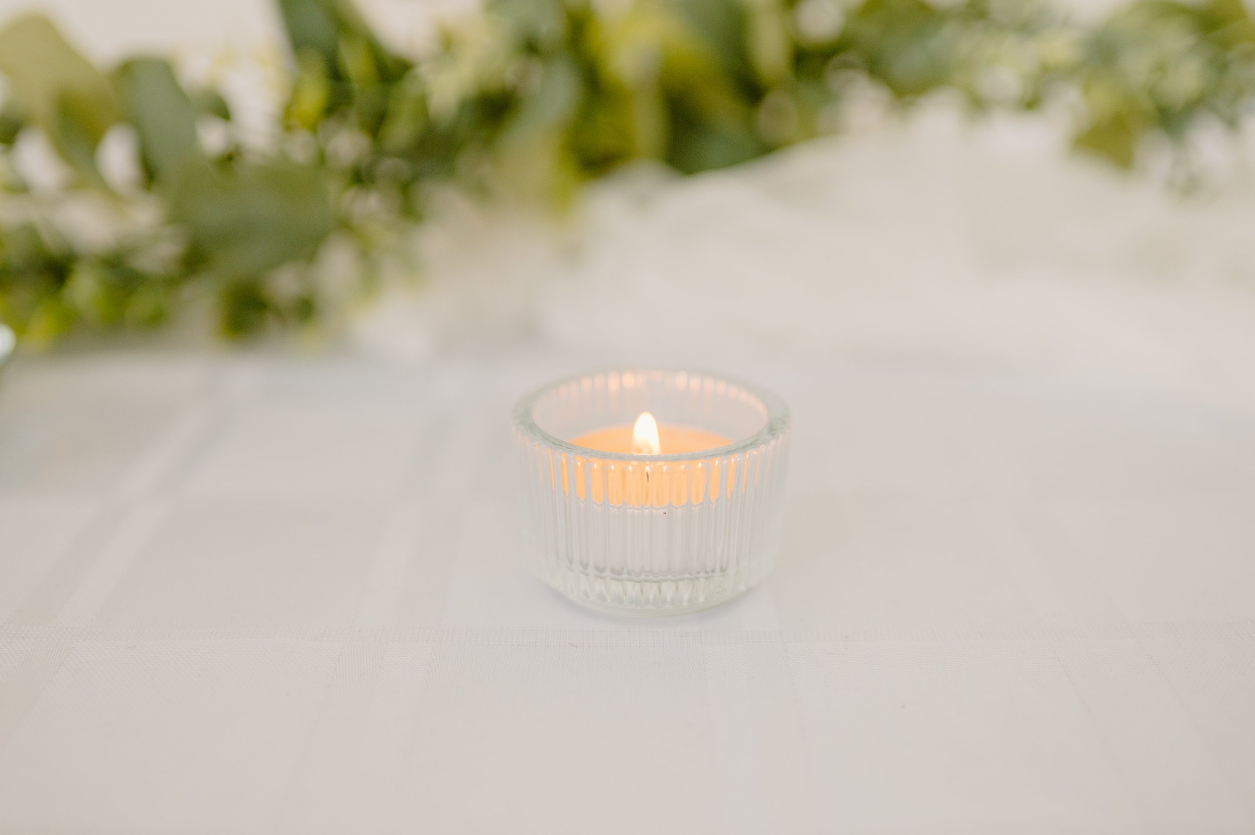 Ribbed glass tealight candle holder. 1 real white candle.  1-day rental $3. 