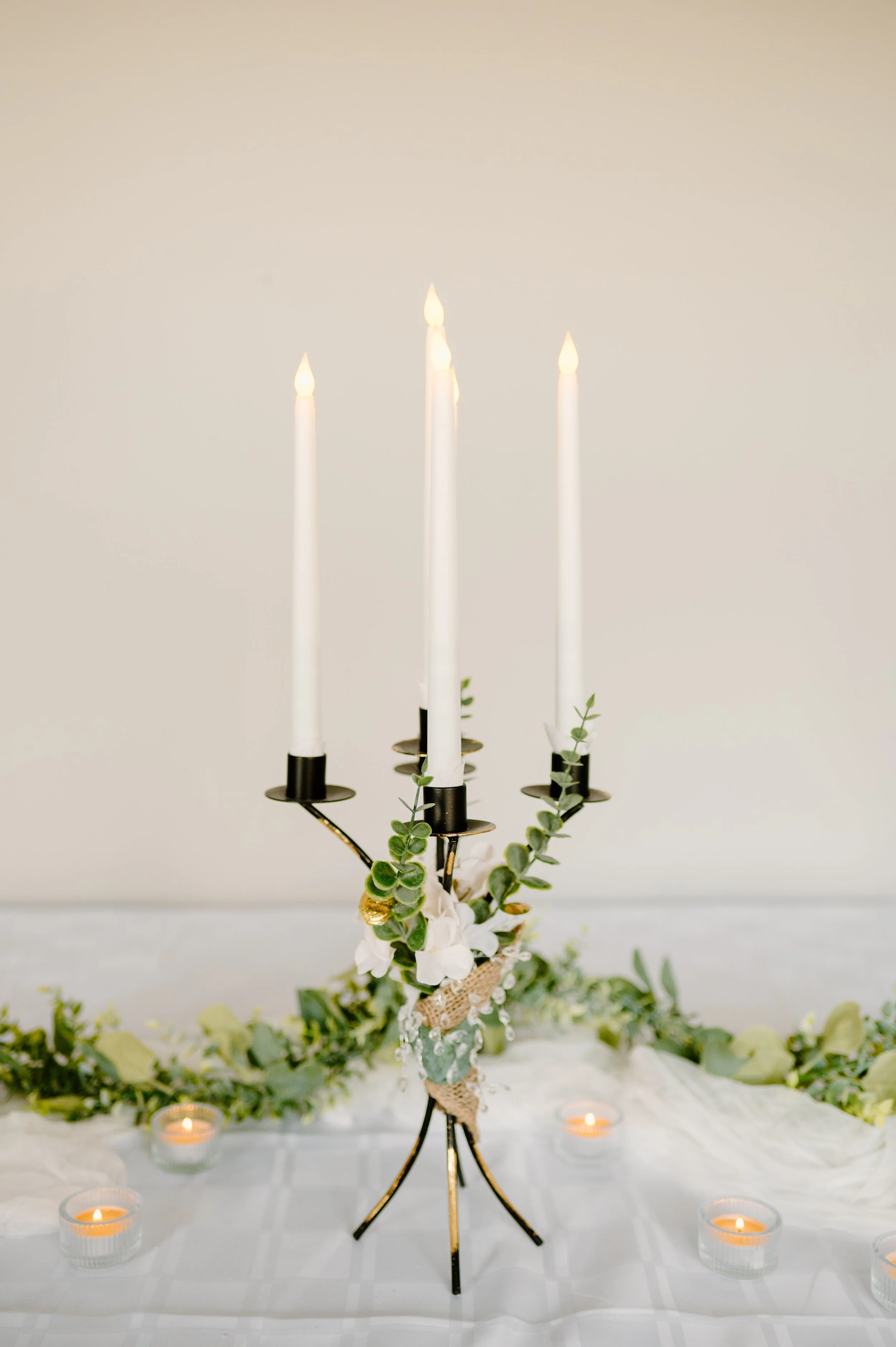 Black and gold candelabra, 5 candles.
24" H with candles.  1-day rent is $30. 
