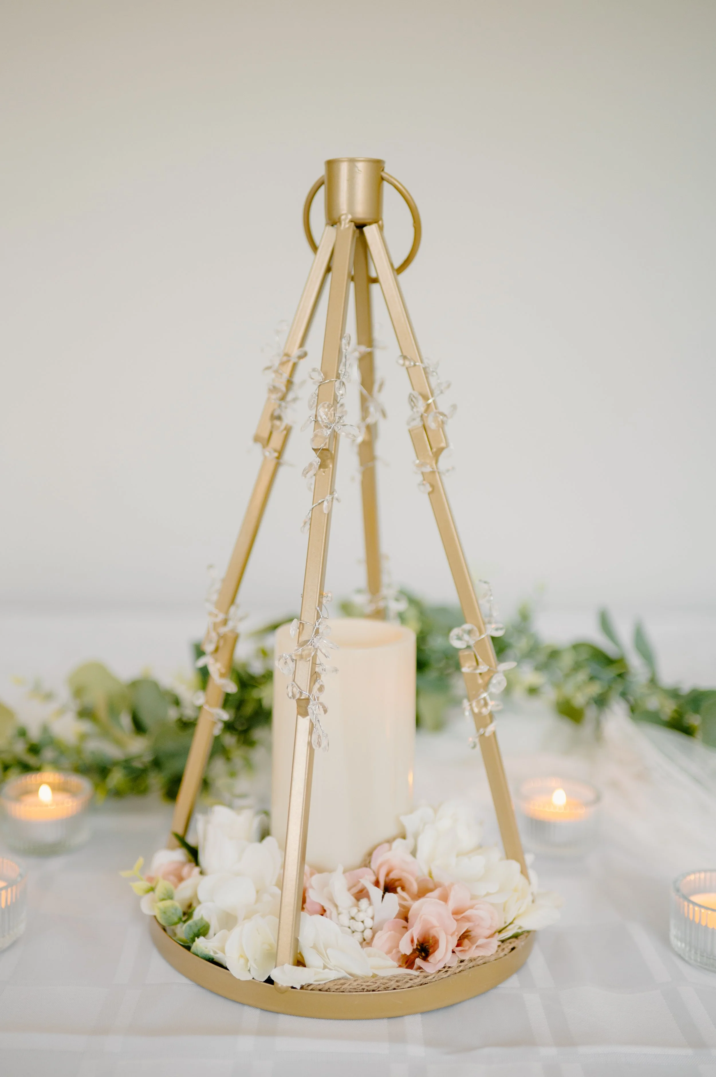 Gold pyramid lantern. 1 candle. 
16" H. 1-day rental $30. 