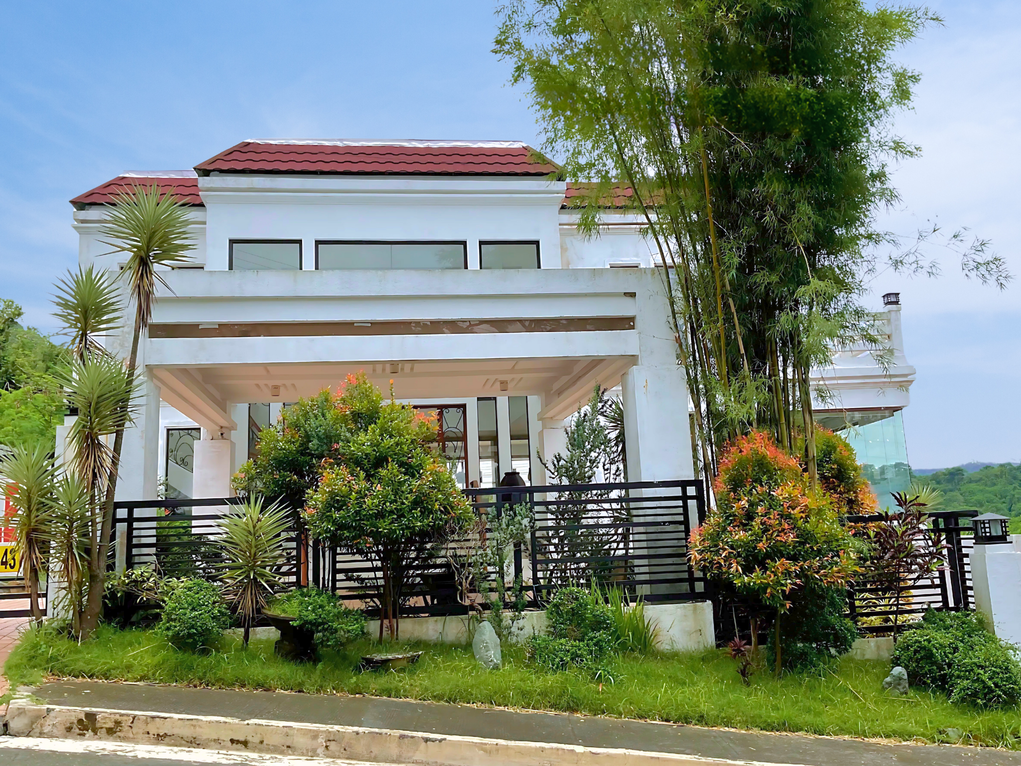 Spacious 2 storey fully furnished estate in Splendido Taal, Laurel Batangas with 17 bedrooms, 11 baths, infinity pool, large courtyard, and unobstructed Taal Volcano views.