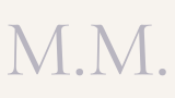 Monogram with the letters 'M. M.' in a serif font, light purple color on a white background.