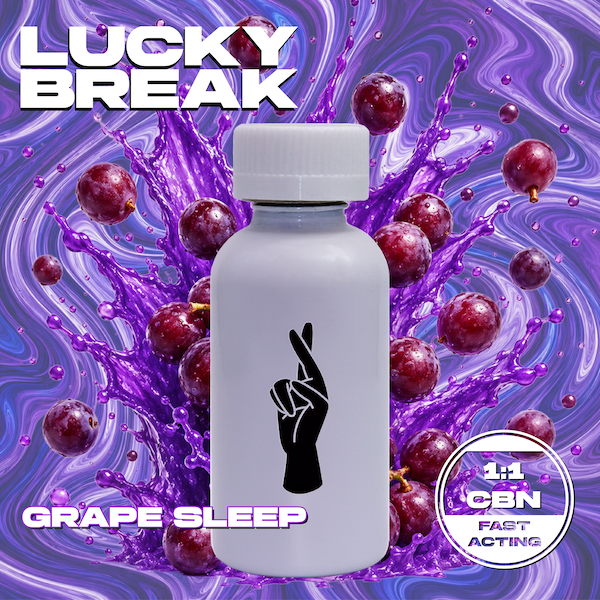 A white pill bottle with a black hand symbol making a peace sign, set against a background of purple grapes and purple swirling liquid, with text that reads 'Lucky Break Grape Sleep 1.1 CBN' and 'Fast Acting'.