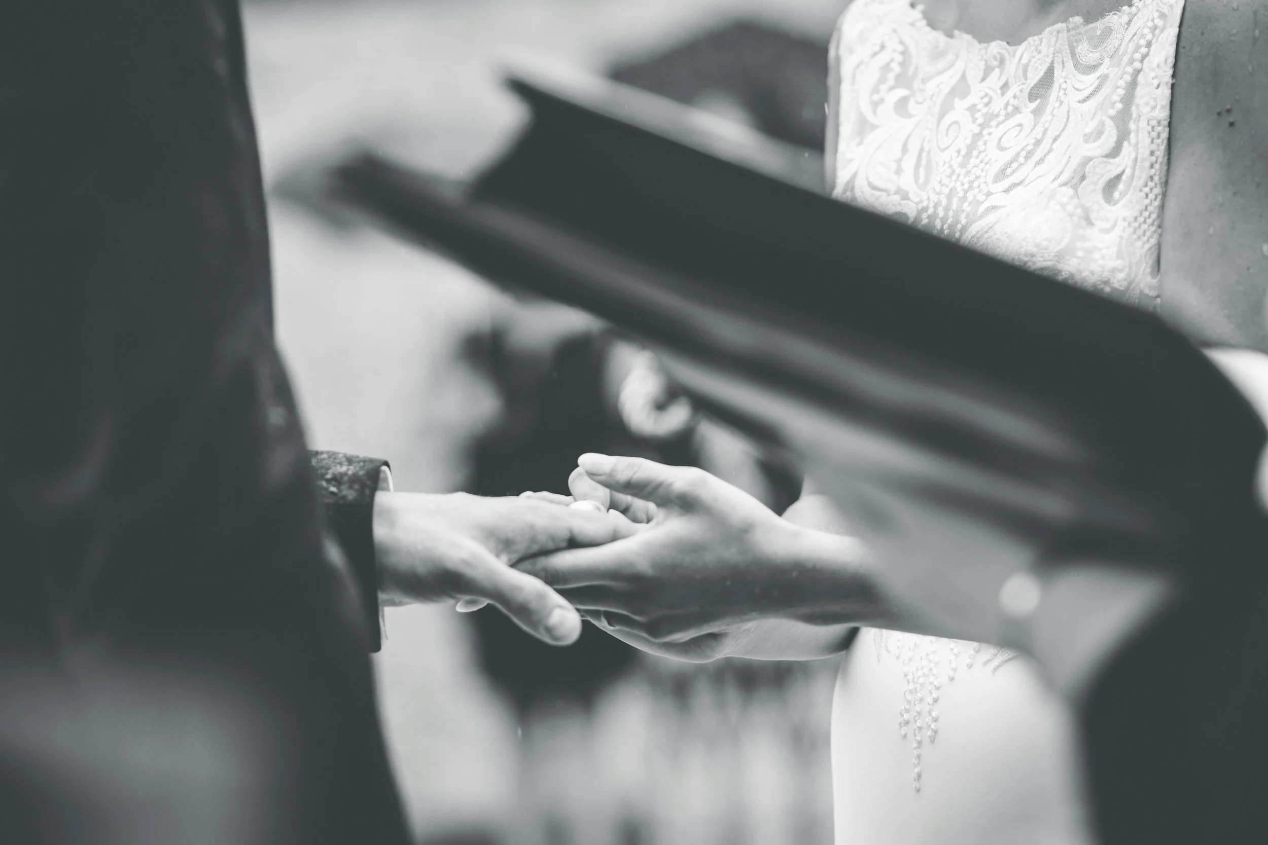 couple holding hands at the altar