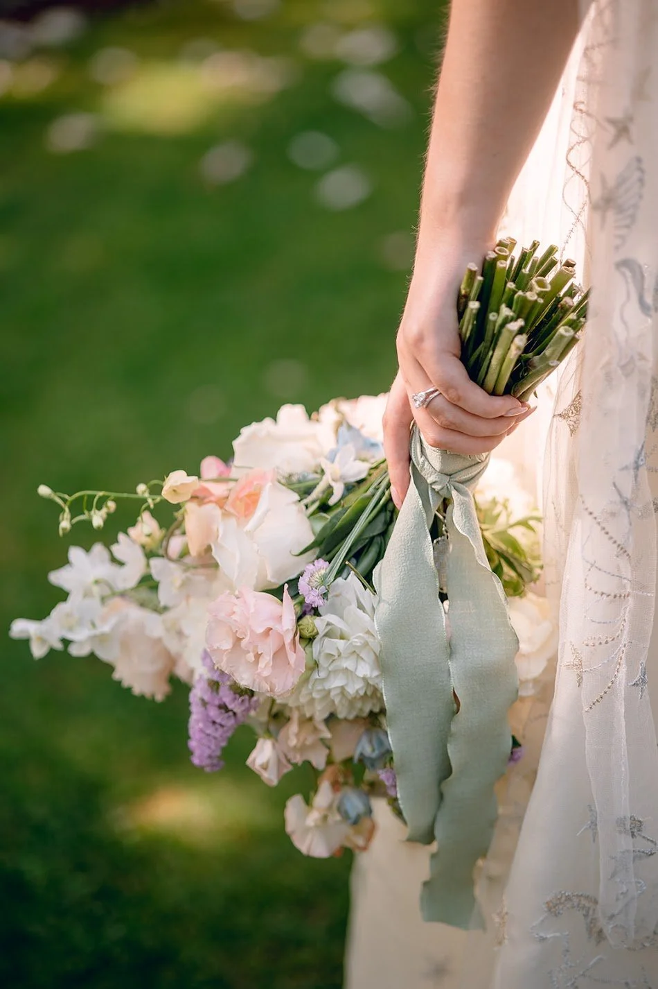 close up of bride holding bouquet