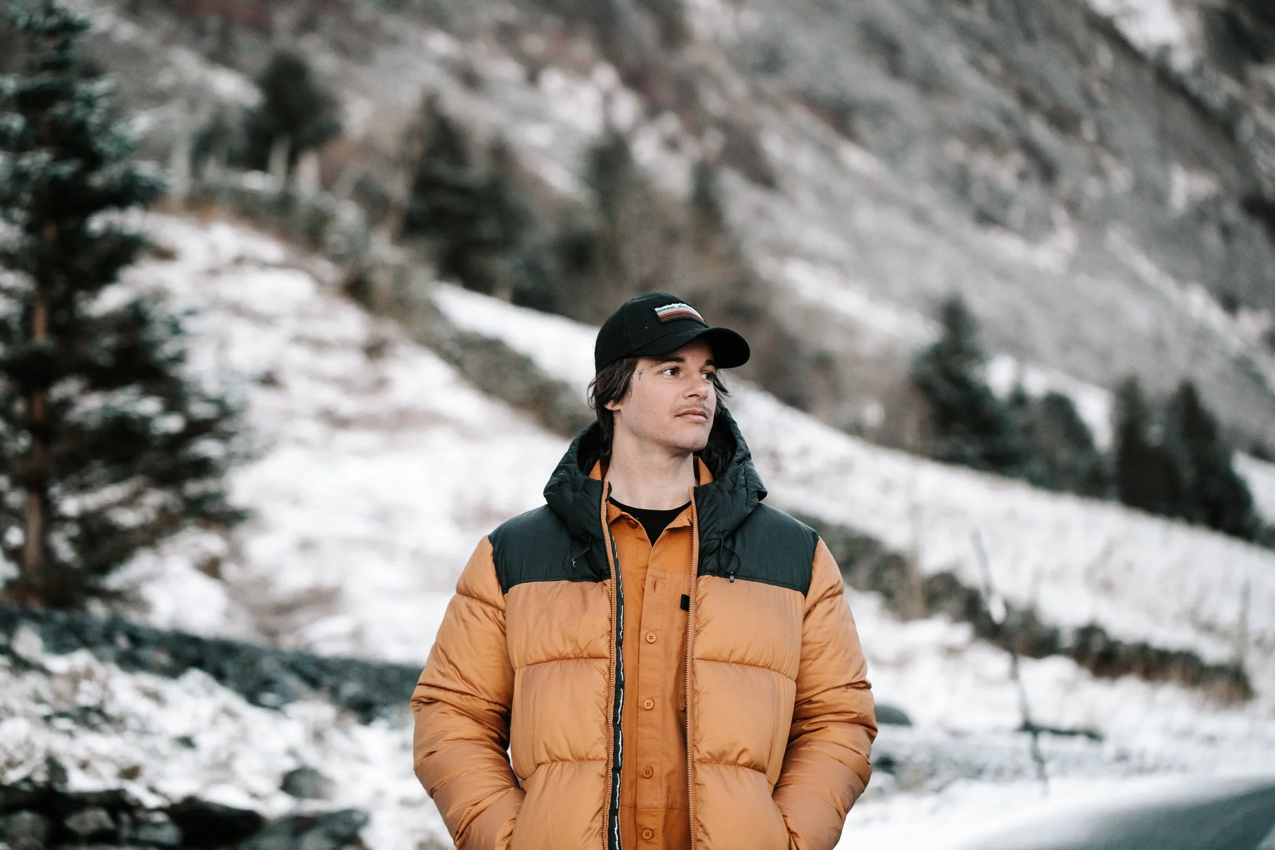 Male model in down jacket in winter surroundings