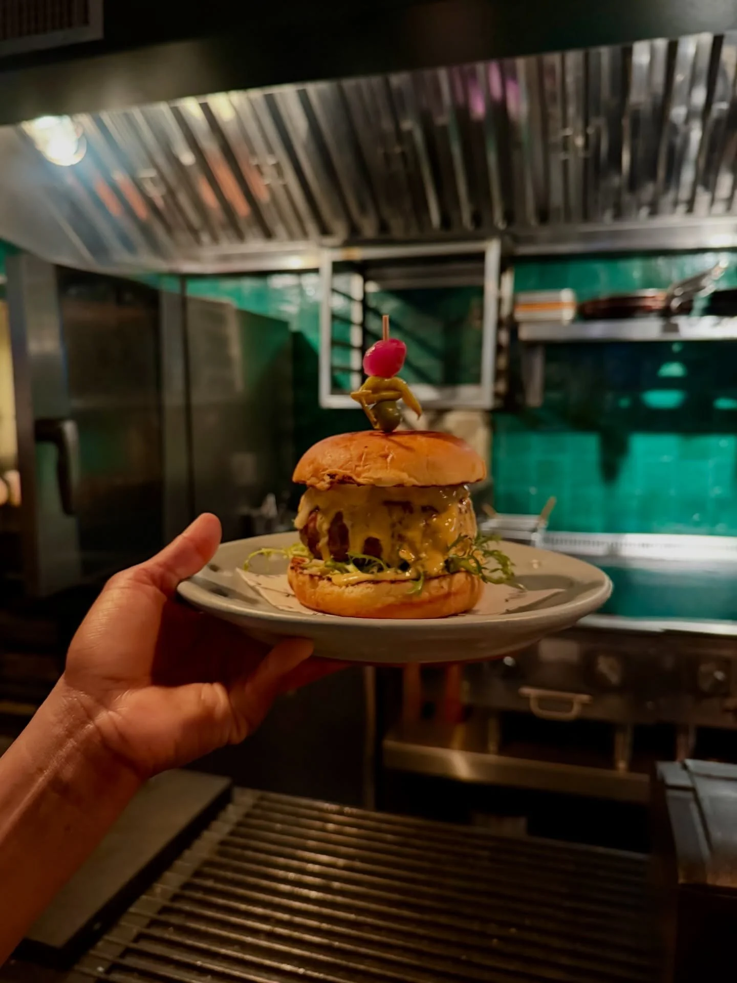 Our new Al Pastor Lamb Burger - Available only for January!

Al pastor originated in central Mexico in the mid-20th century, inspired by Lebanese immigrants who brought lamb shawarma and the technique of cooking meat on a vertical spit.
Mexican cooks