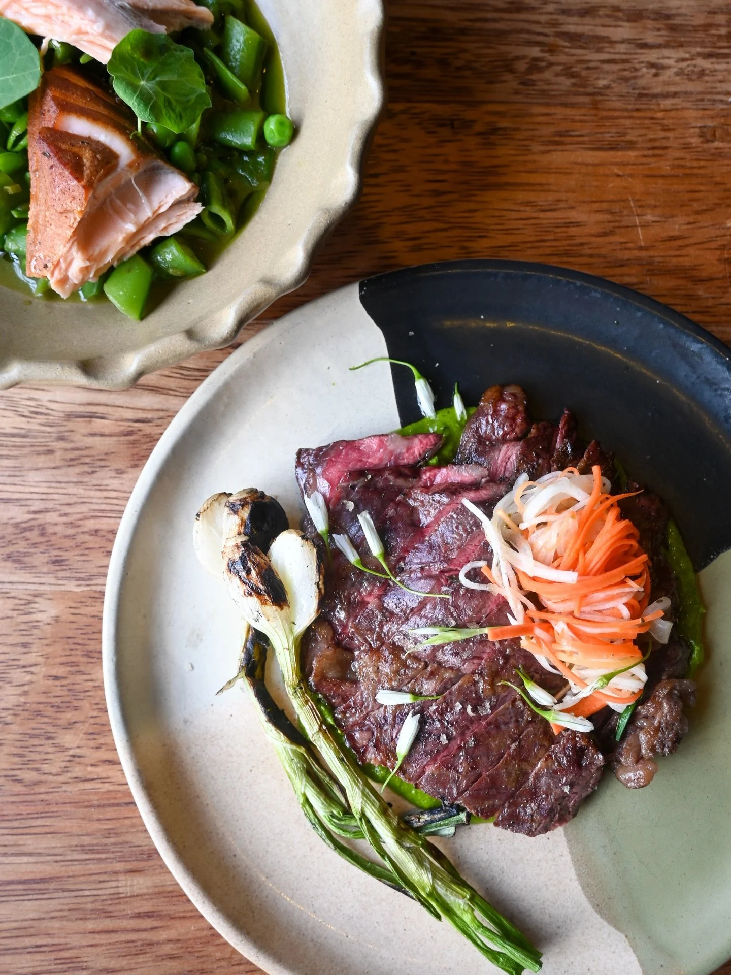 Wagyu Skirt Steak with Ramps, Pickled Spring vegetables and grilled Tropea Onion