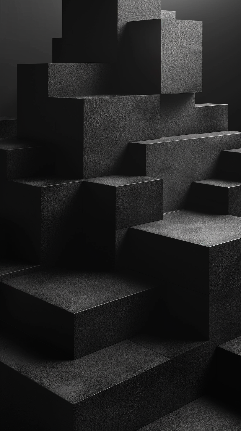 Multiple black geometric blocks of varying sizes stacked in an abstract arrangement with soft lighting and shadows.