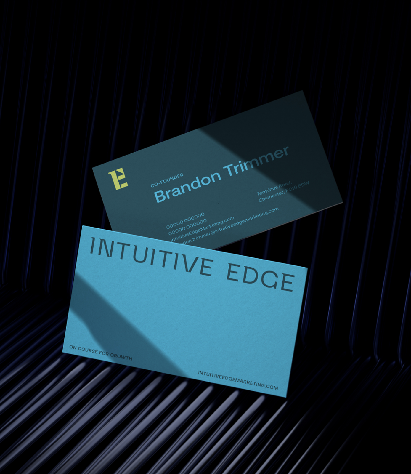 Business card design for Intuitive Edge golf marketing agency featuring refined typography and modern brand identity