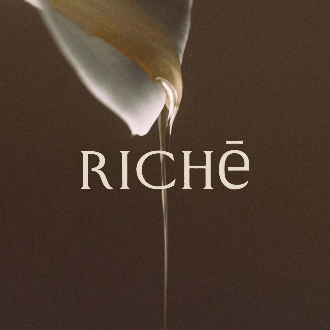 Luxury branding concept for Richē, a Congo-inspired wellness and honey brand featuring warm earthy tones, flowing honey imagery, refined serif typography, and elevated packaging design inspired by Kuba patterns and natural rituals.