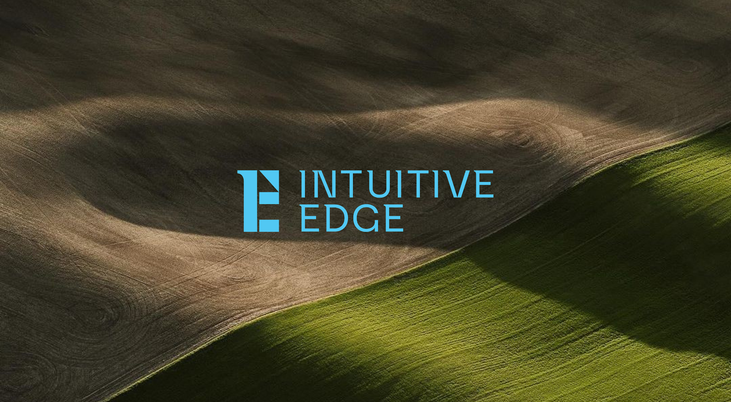 Brand identity application for Intuitive Edge with logo over natural landscape, reflecting refined and performance-led golf branding